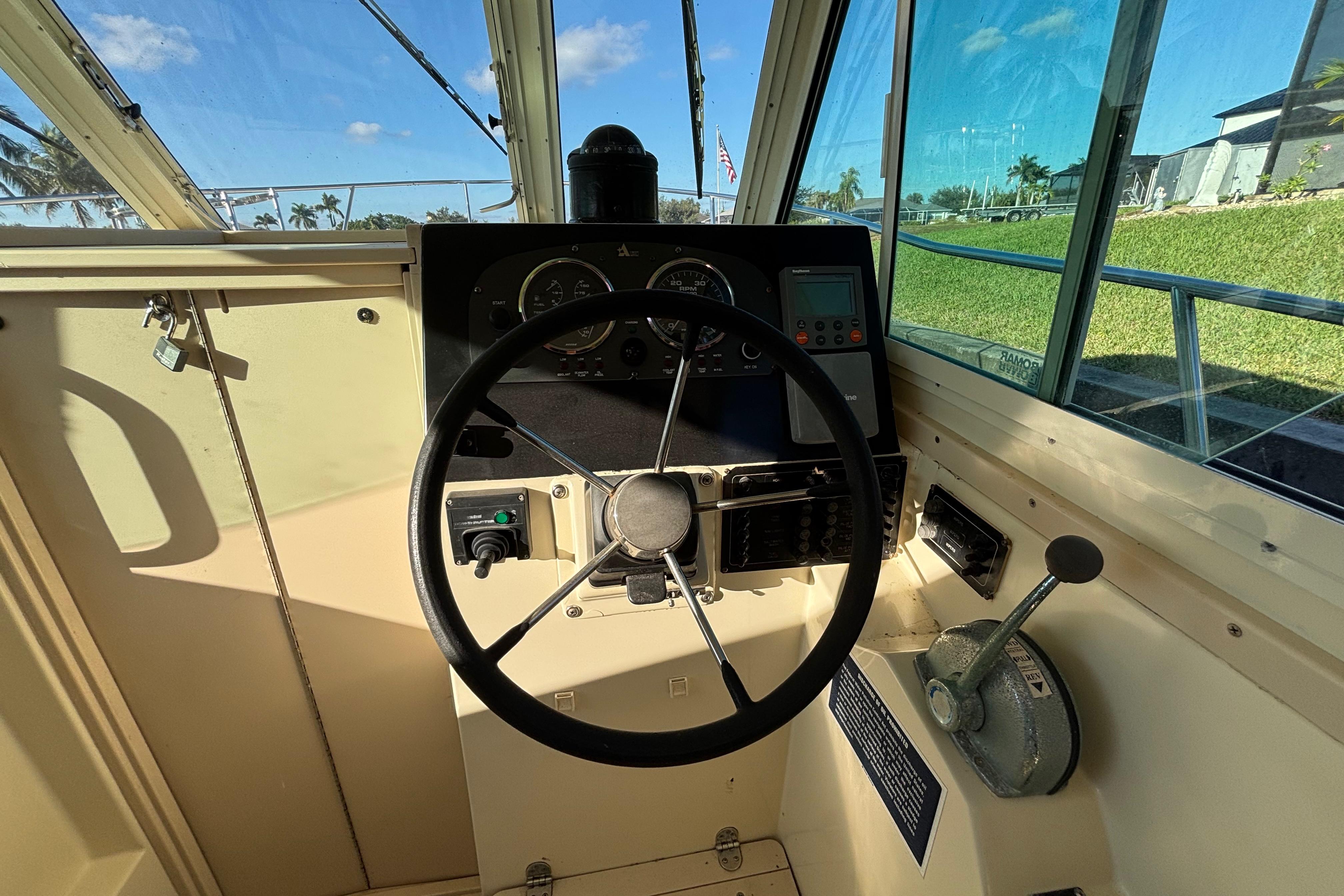 Helm of 2001 Albin 28 Tournament Express boat with steering wheel and control panel.