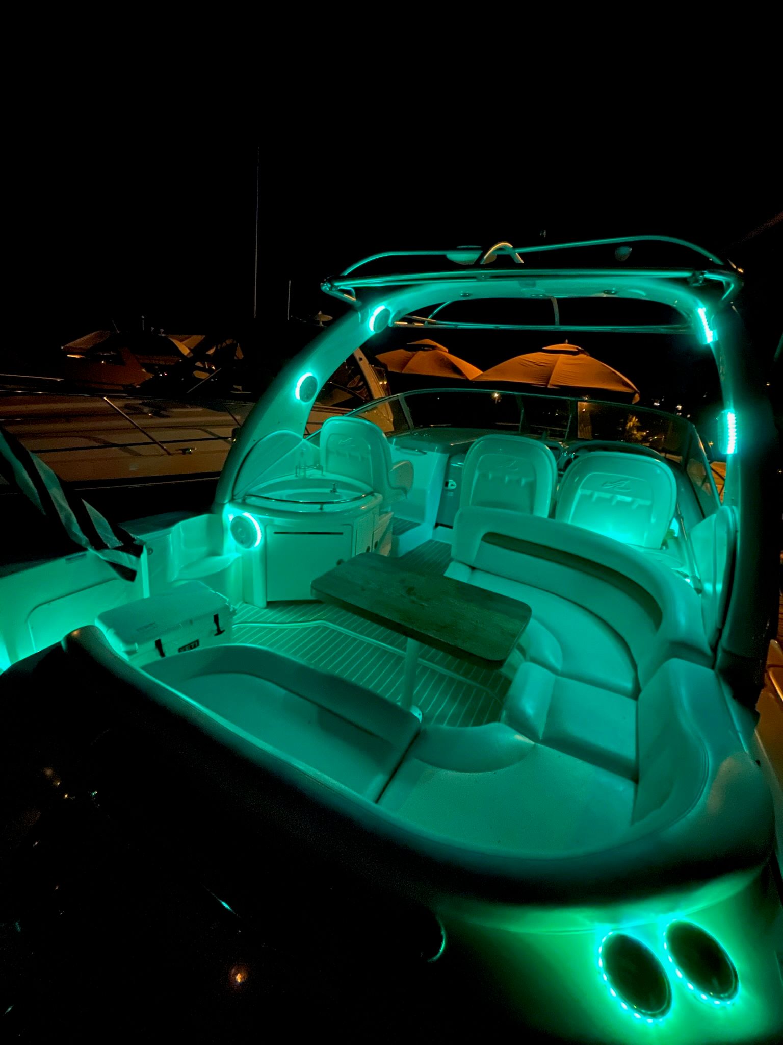 Illuminated cockpit of a 2007 Sea Ray 340 Sundancer at night.