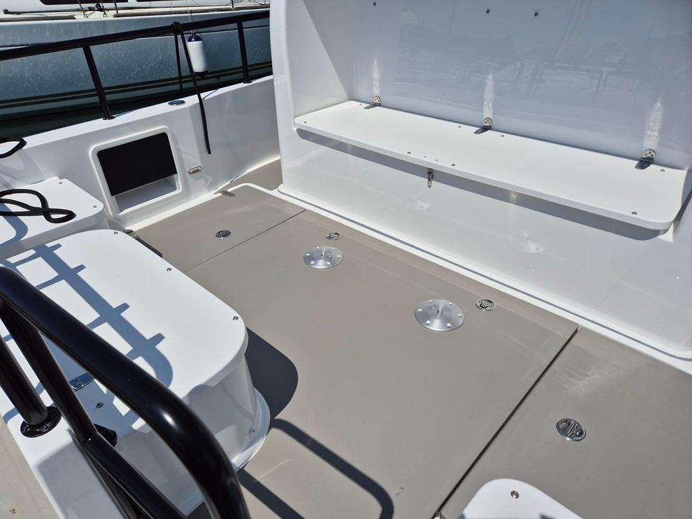 Spacious deck of 2025 Nord Star 28 Plus boat with seating and storage.