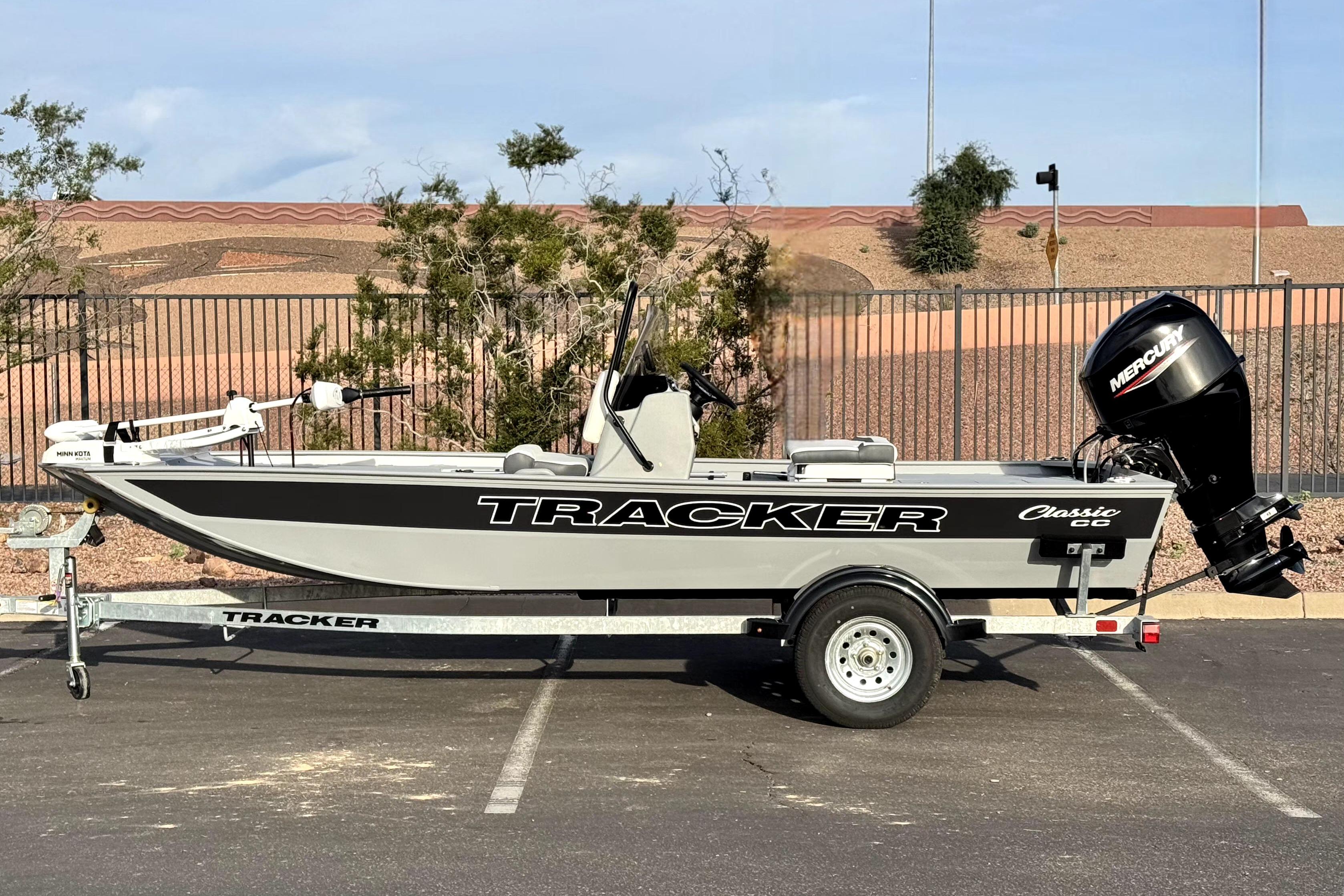 2026 Tracker Bass Tracker Classic CC boat on trailer, parked outdoors.