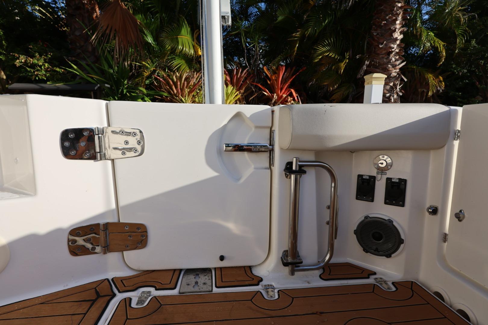 2025 Boston Whaler 325 Conquest boat interior with teak flooring and stainless steel fittings.