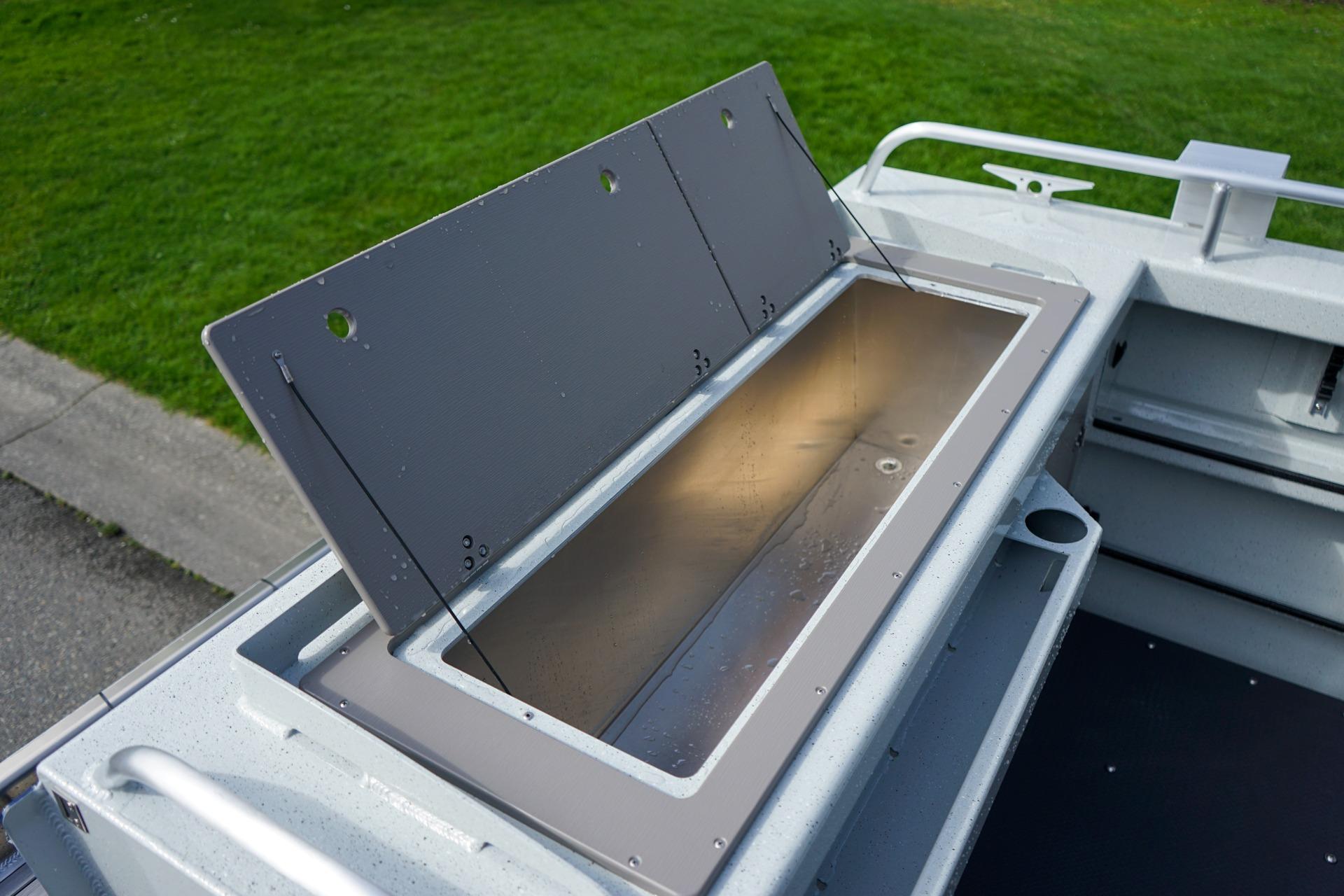 2026 Weldcraft 220 Ocean King boat storage compartment, open lid, showcasing interior space.