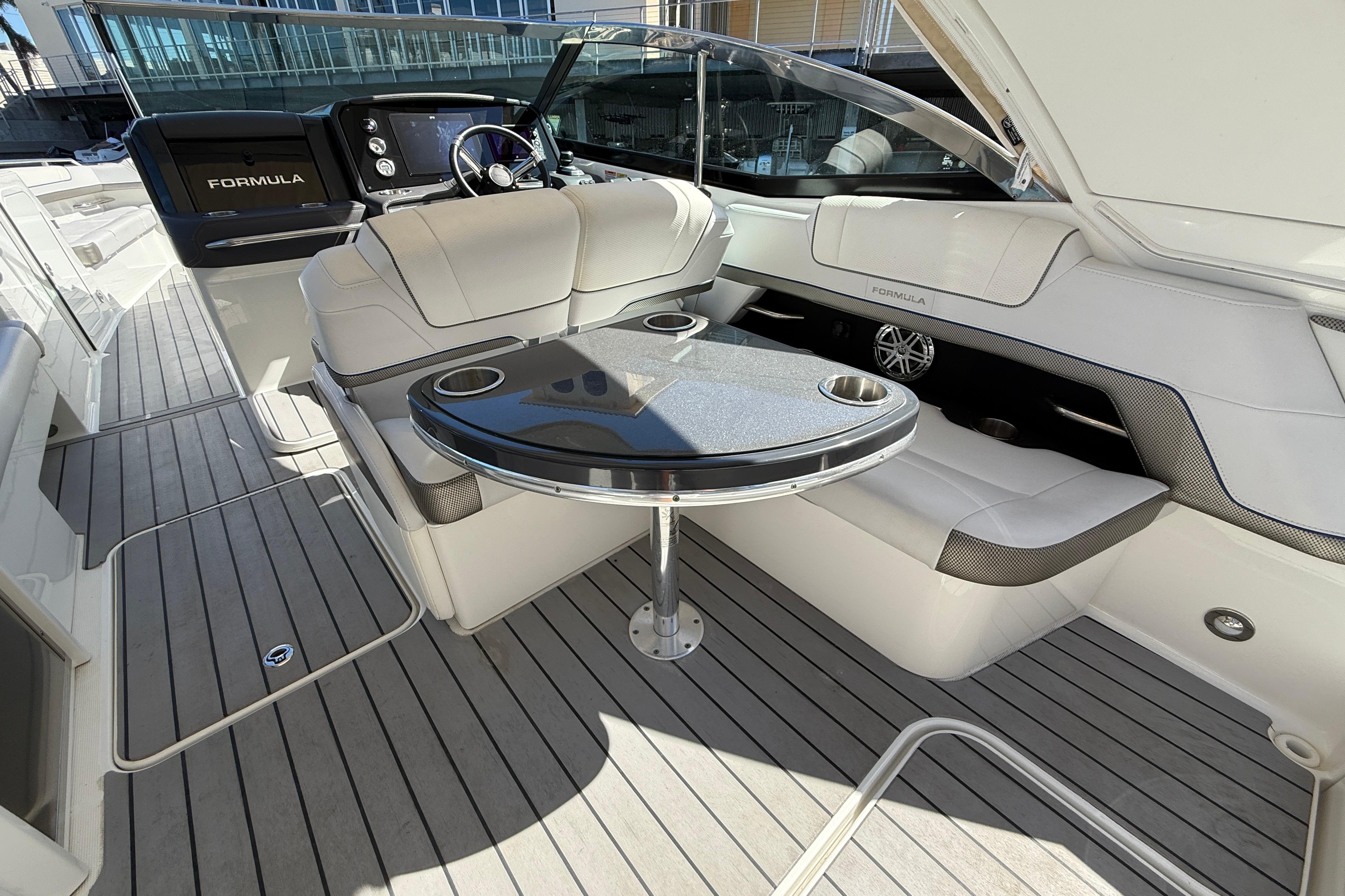 2021 Formula 330 Crossover Bowrider OB interior with sleek seating and modern dashboard.