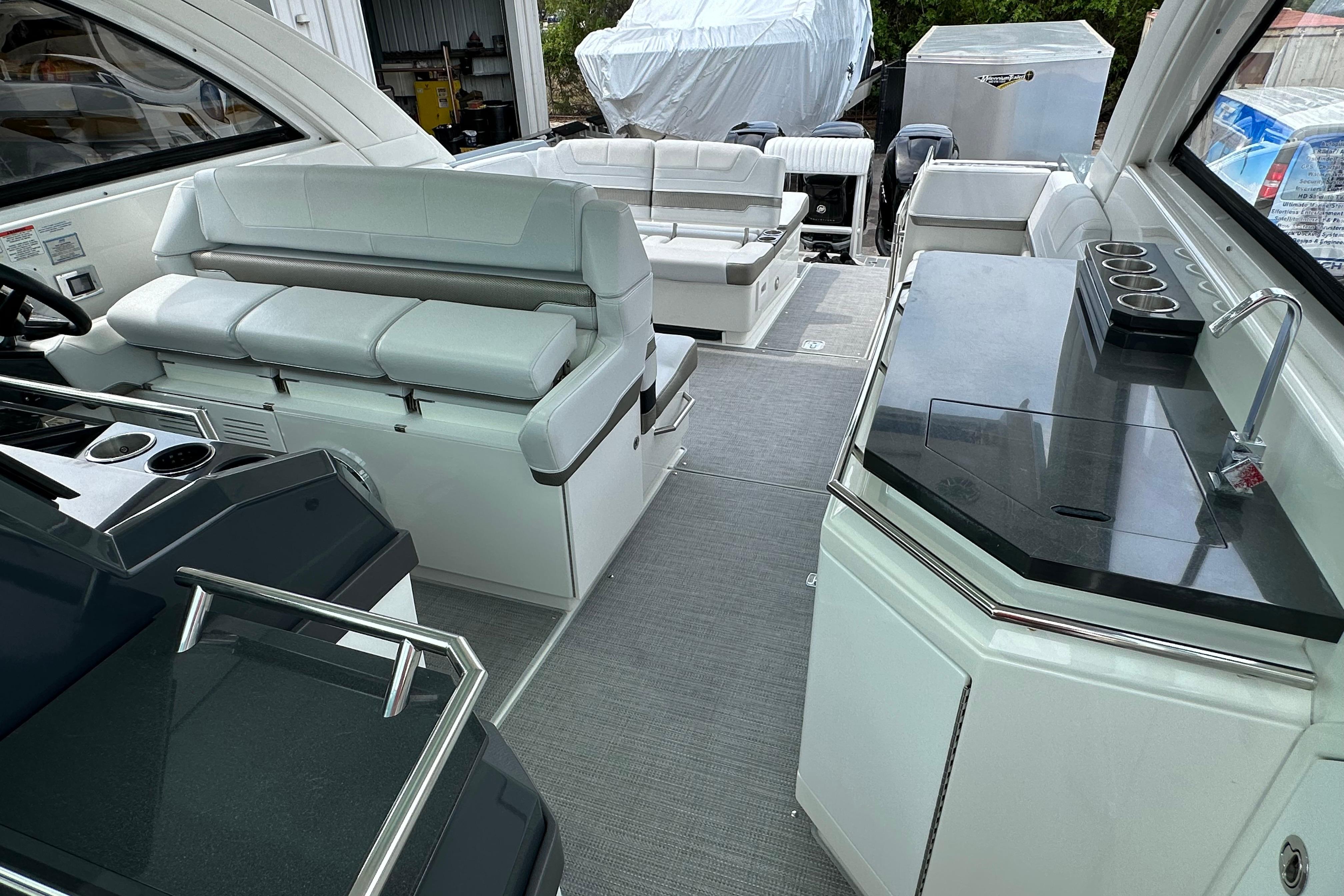 Interior of 2021 Formula 380 Super Sport Crossover OB with seating and kitchenette.