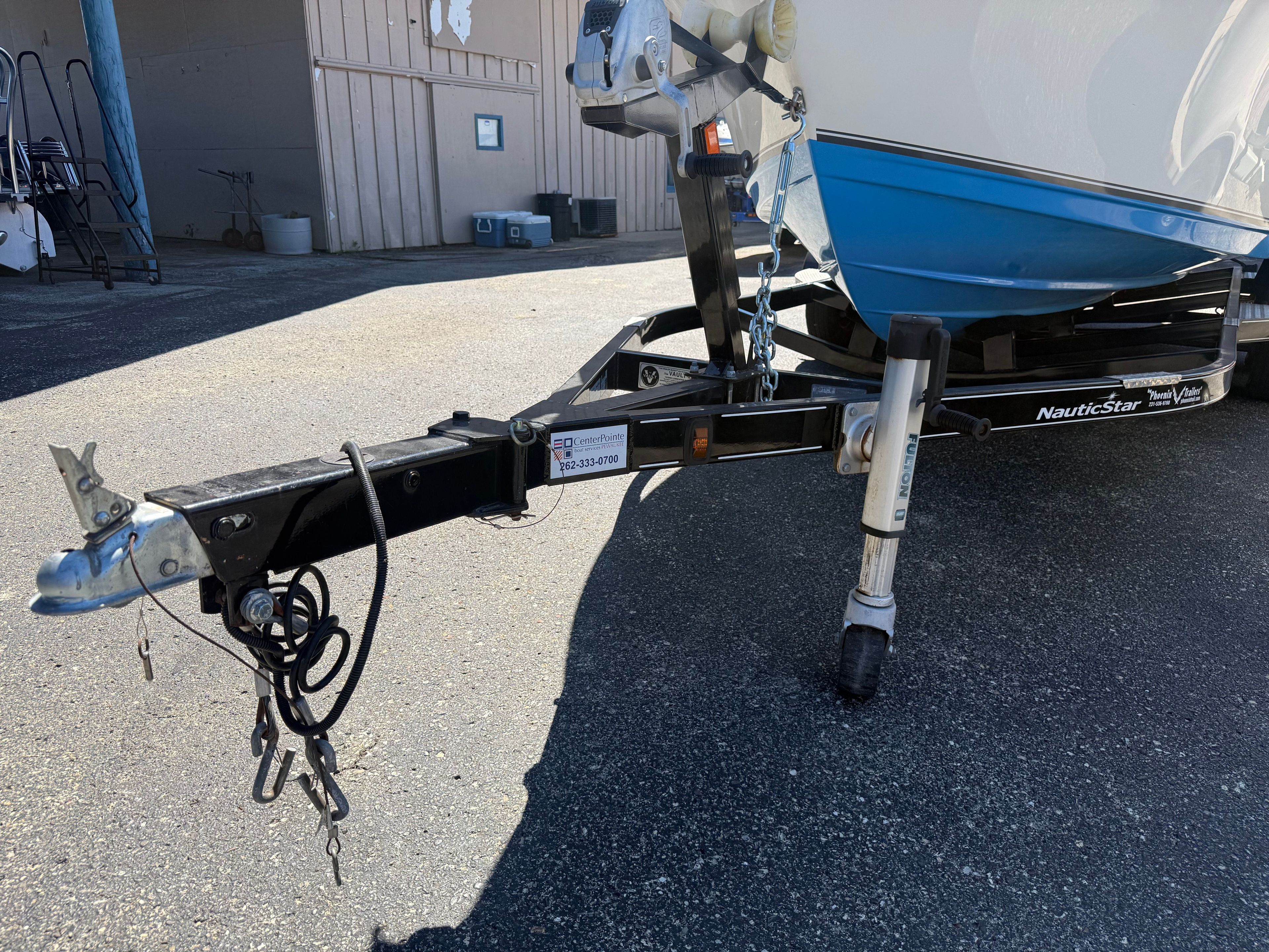 A NauticStar boat on a trailer, ready for transport.