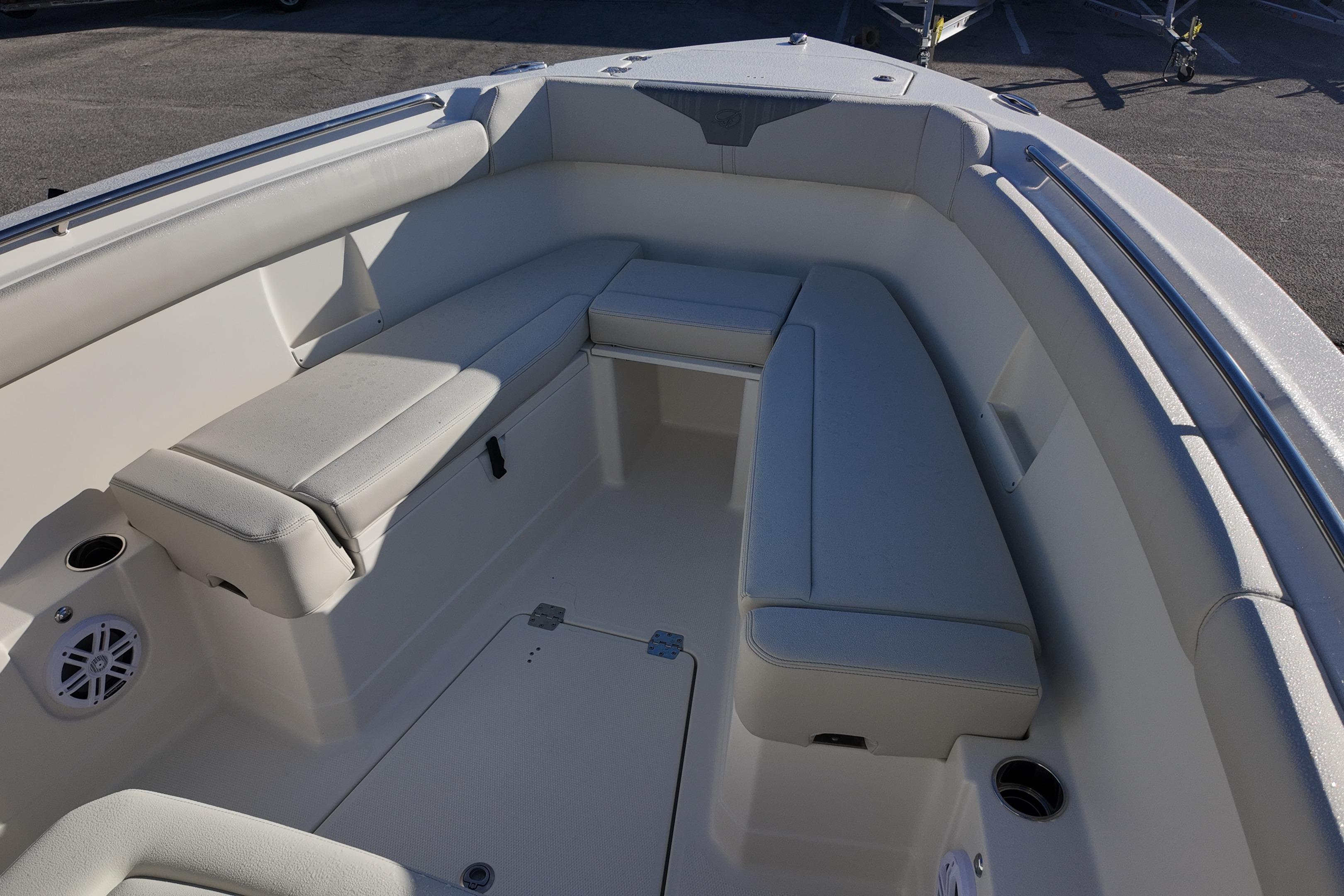 2026 Sailfish 272 CC boat interior with cushioned seating and cup holders.