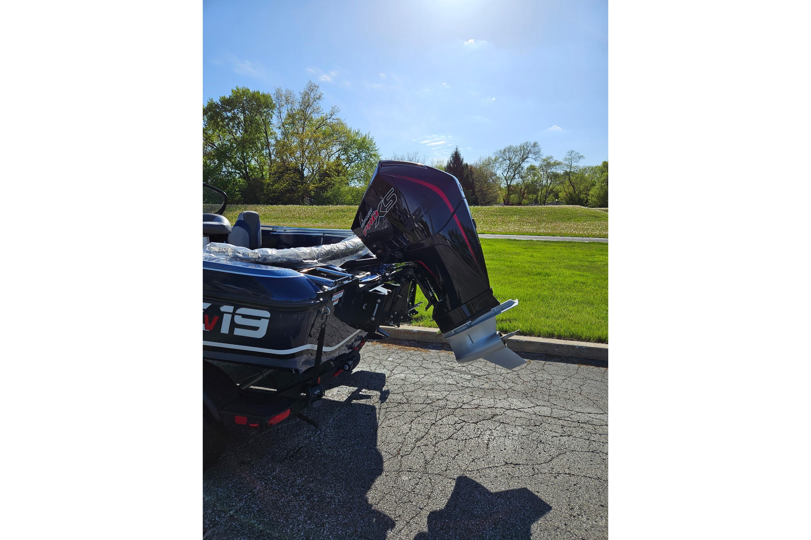 2026 Nitro ZV19 Sport Pro boat with powerful outboard motor, parked on sunny day.