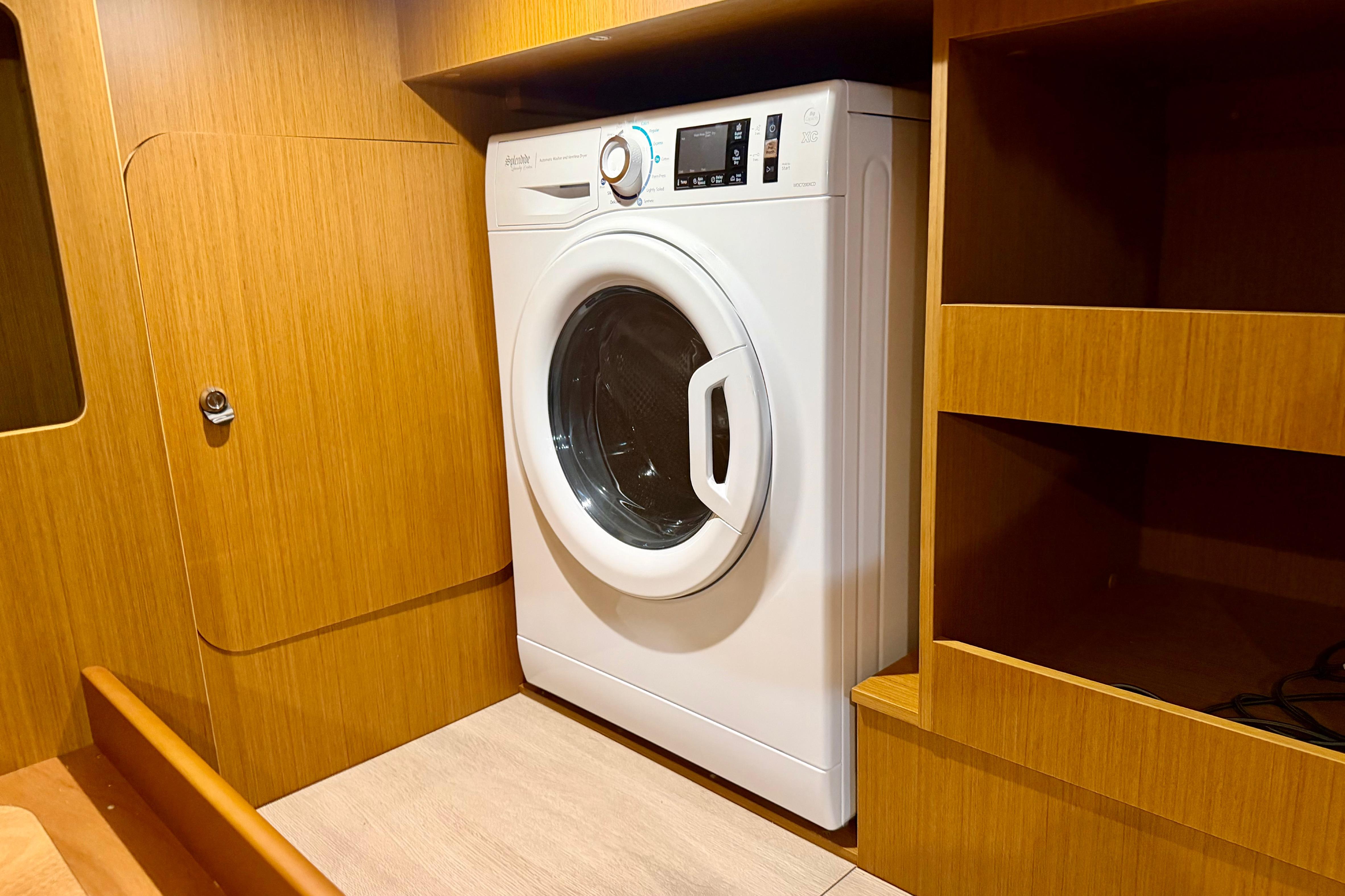 Laundry area in 2025 Beneteau Swift Trawler 41 Fly with washing machine.