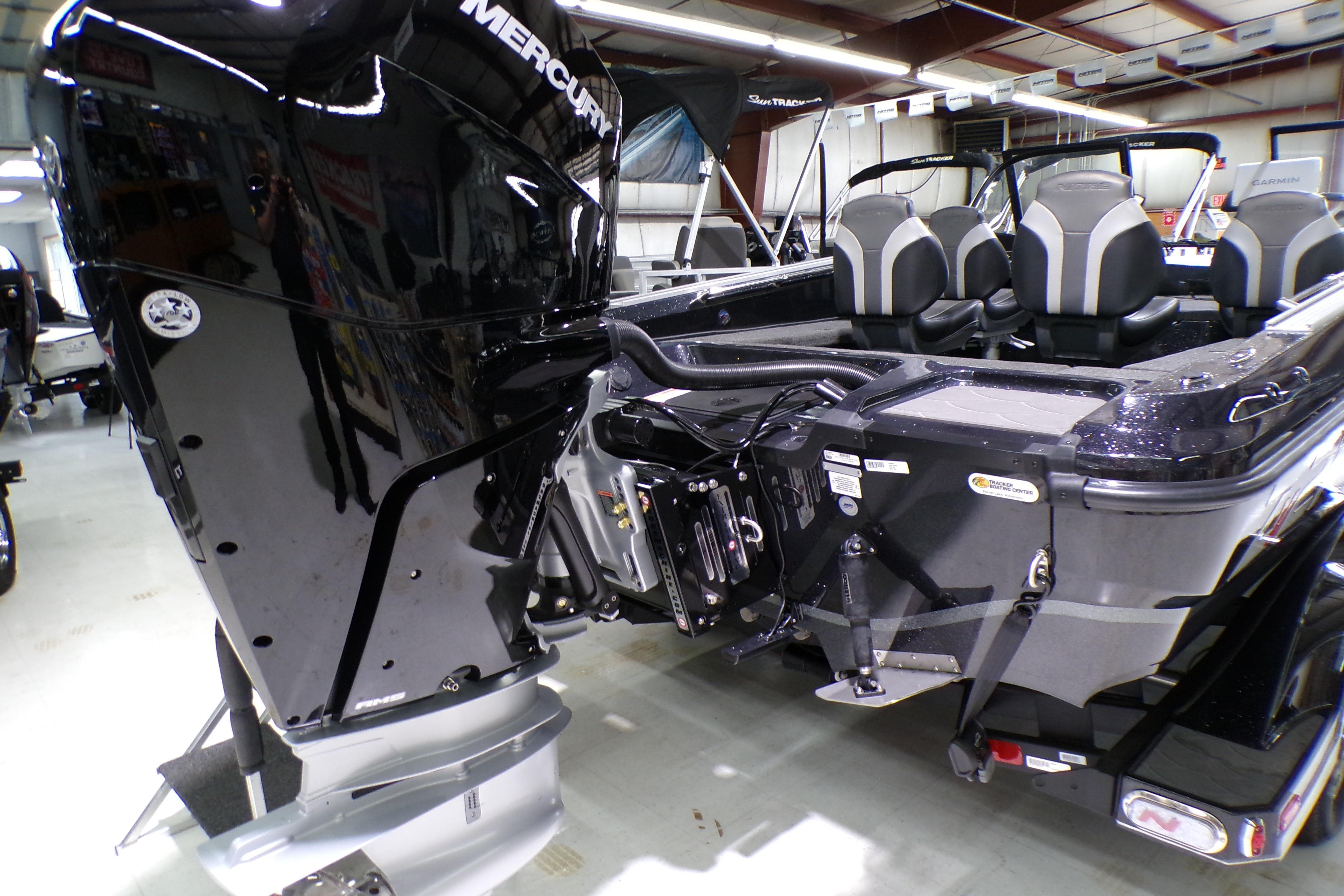 2026 Nitro ZV21 Pro boat with Mercury engine in showroom.