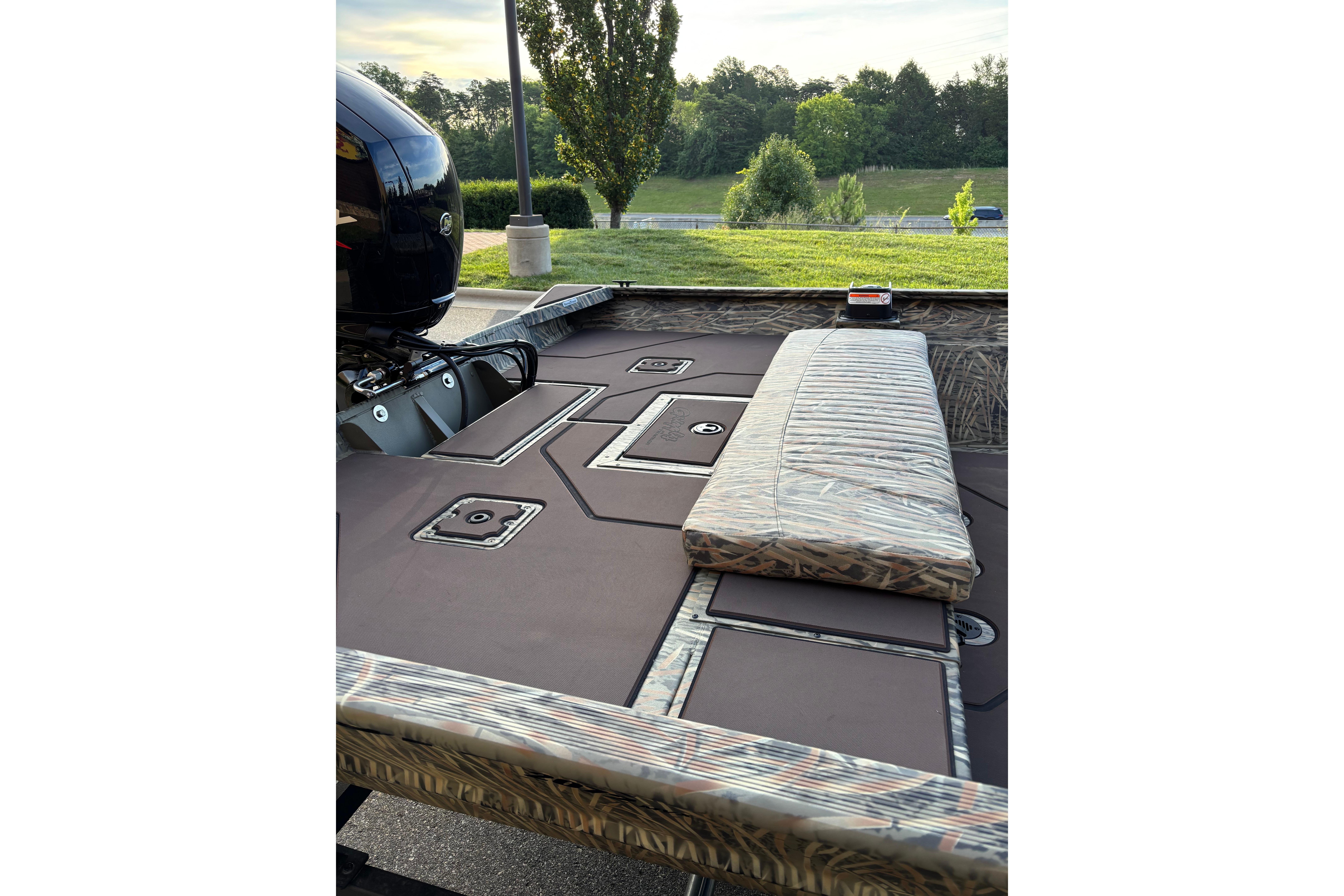2026 Tracker Grizzly 2072 CC boat interior with cushioned seating and storage compartments.