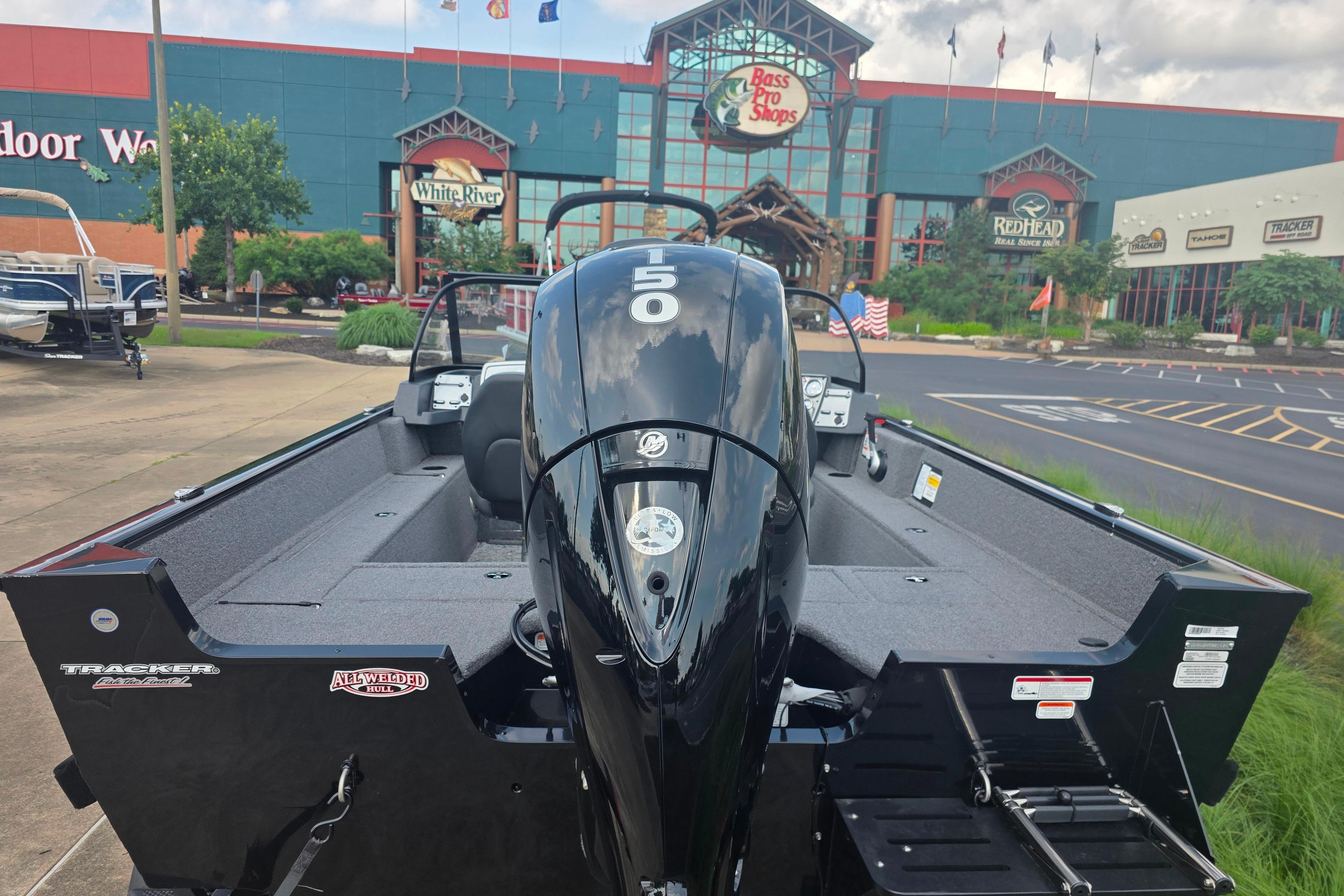 2026 Tracker Pro Guide V-175 Combo boat displayed outside Bass Pro Shops.