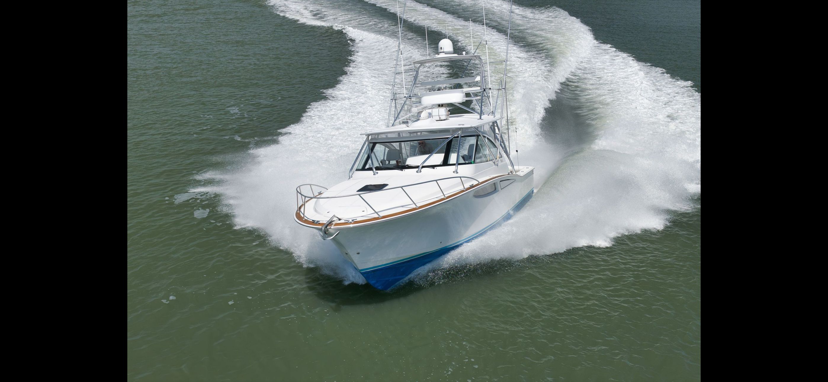 Mag Bay 42 Express 2022 cruising swiftly on water.
