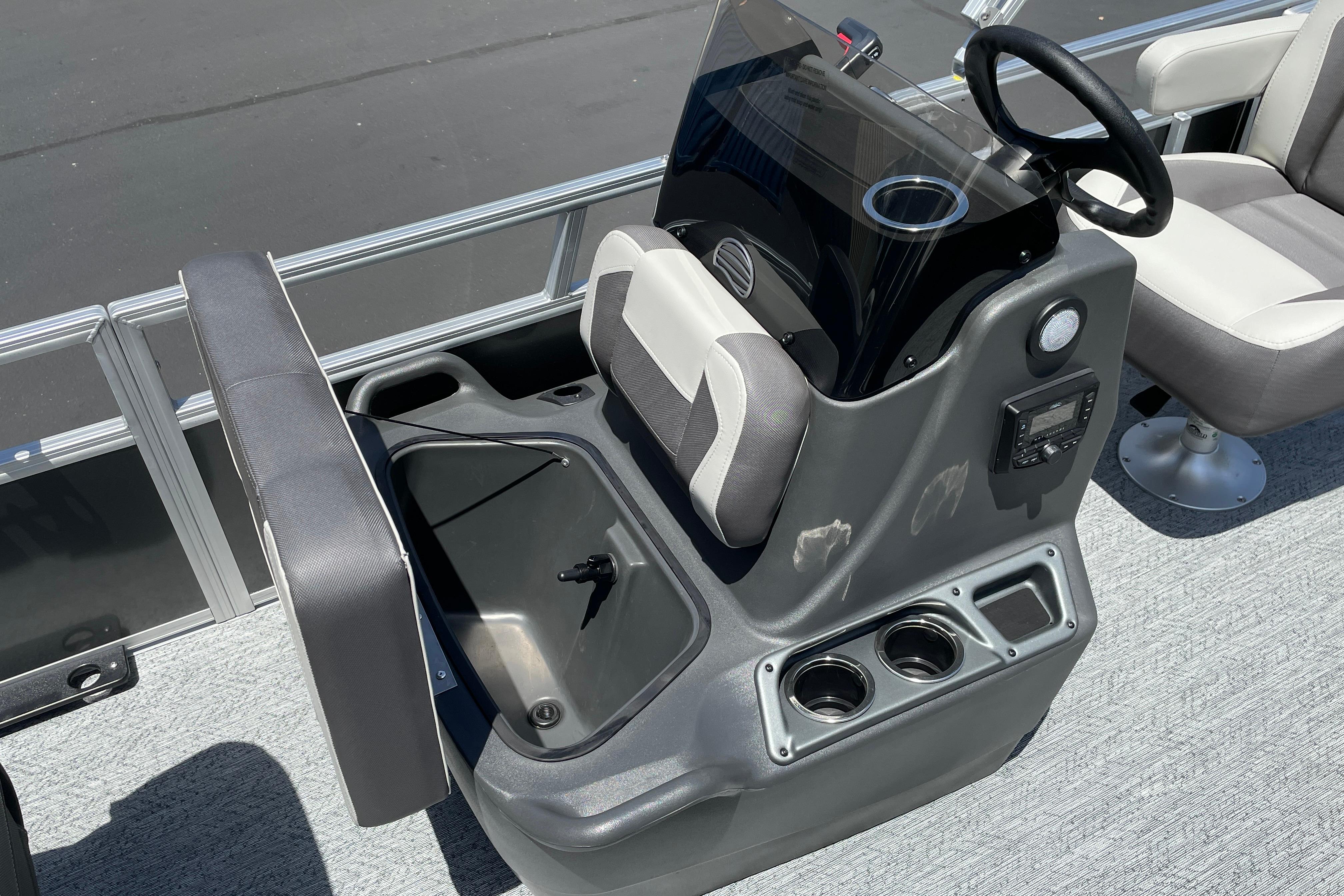 2026 Sun Tracker Bass Buggy 16 XL Select boat console with storage and cup holders.