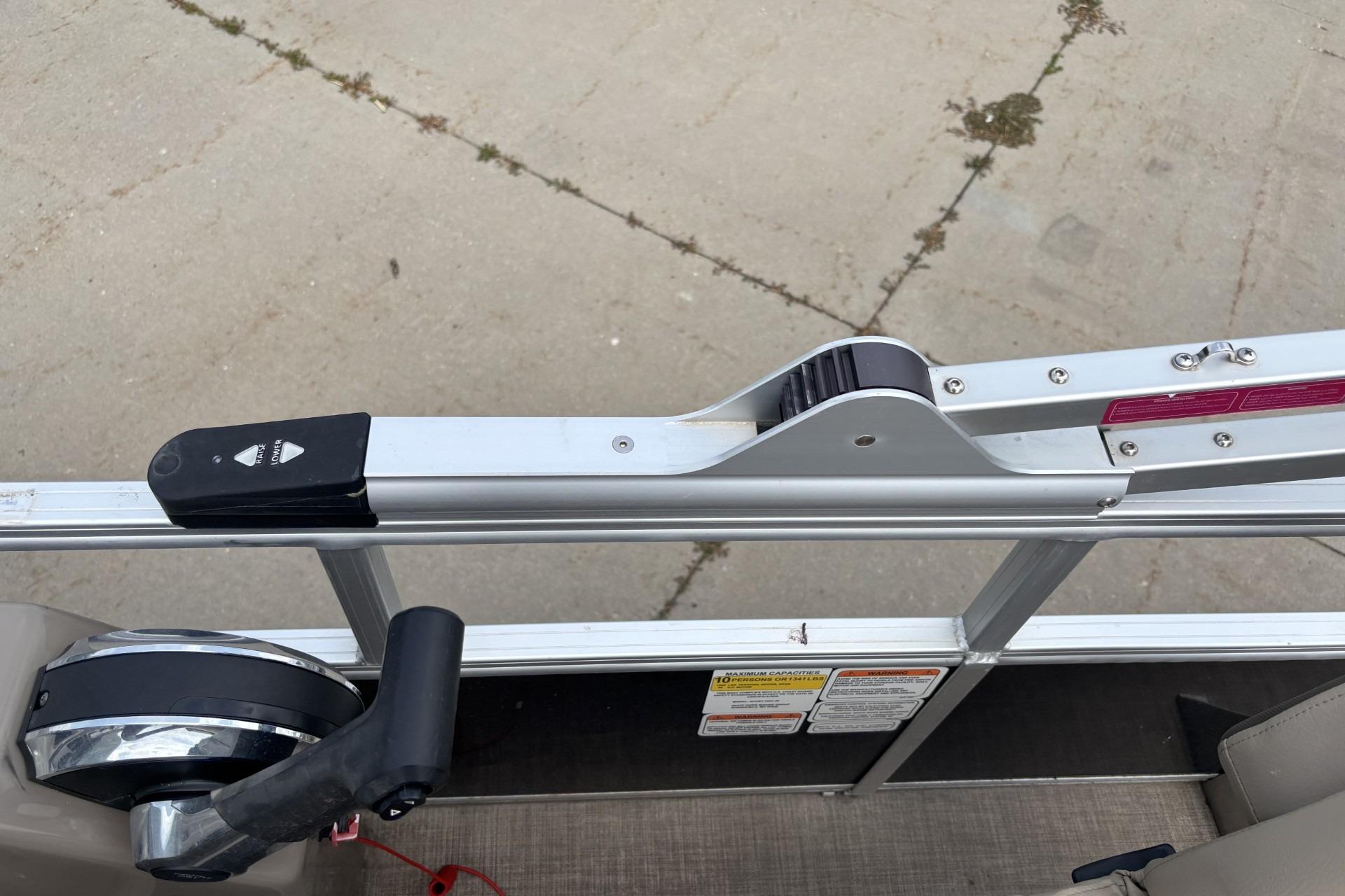 2023 Sun Tracker SportFish 20 DLX boat railing and control panel detail.