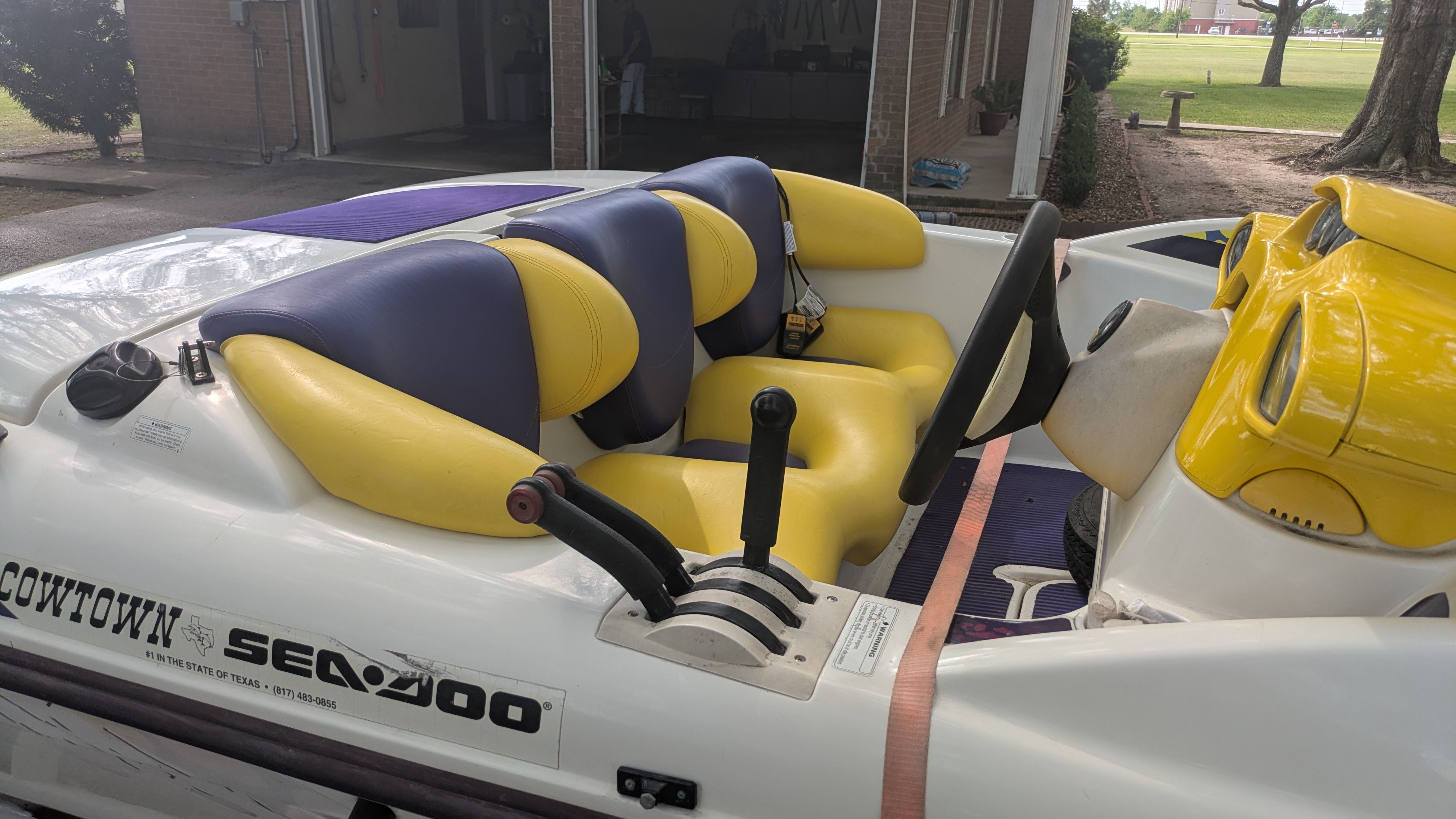 Interior view of a 1995 Bombardier SeaDoo SPEEDSTER with yellow and blue seats.