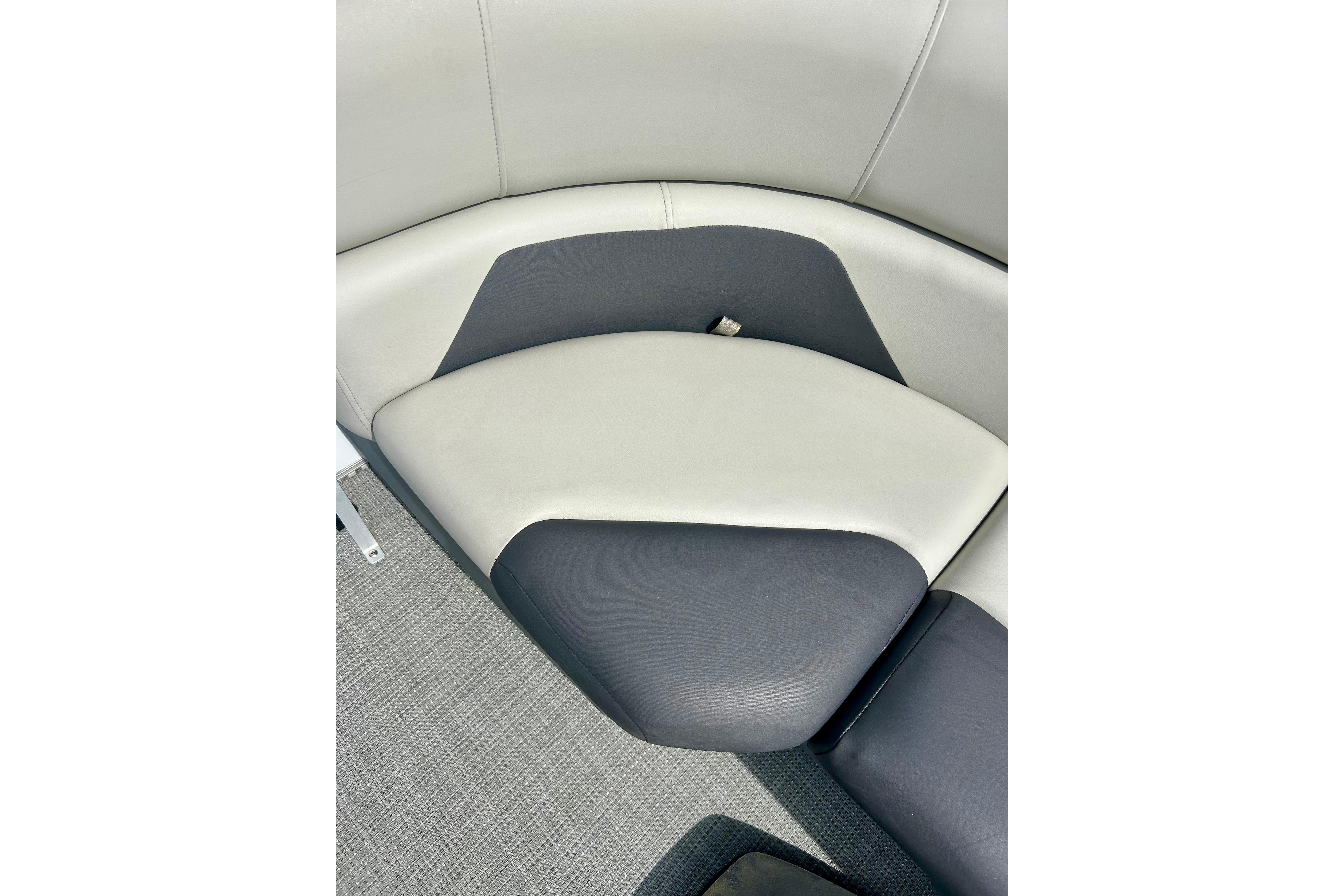 2023 Sun Chaser Geneva boat seating with gray and white upholstery.