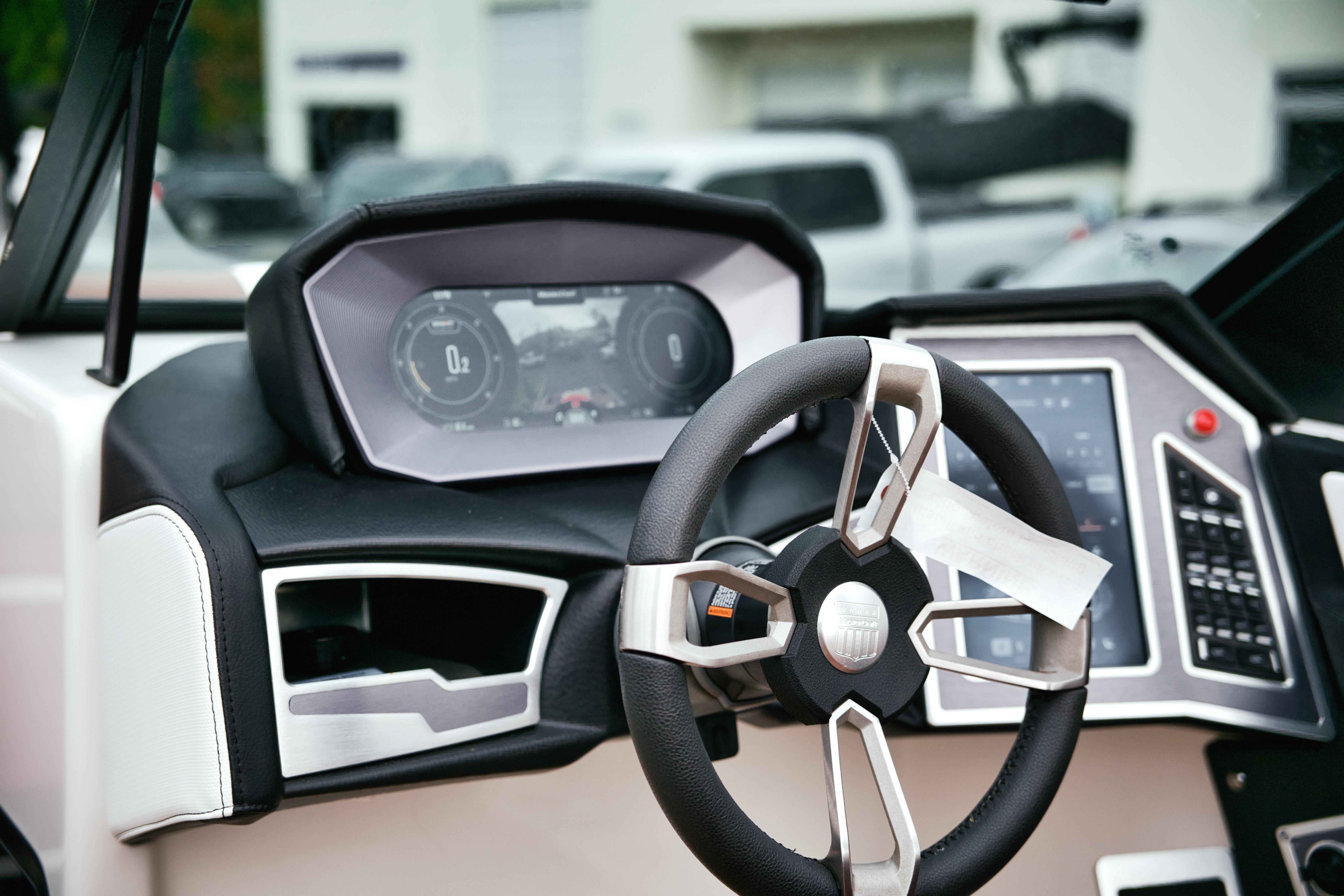 2022 MasterCraft X24 dashboard with modern steering wheel and digital display.