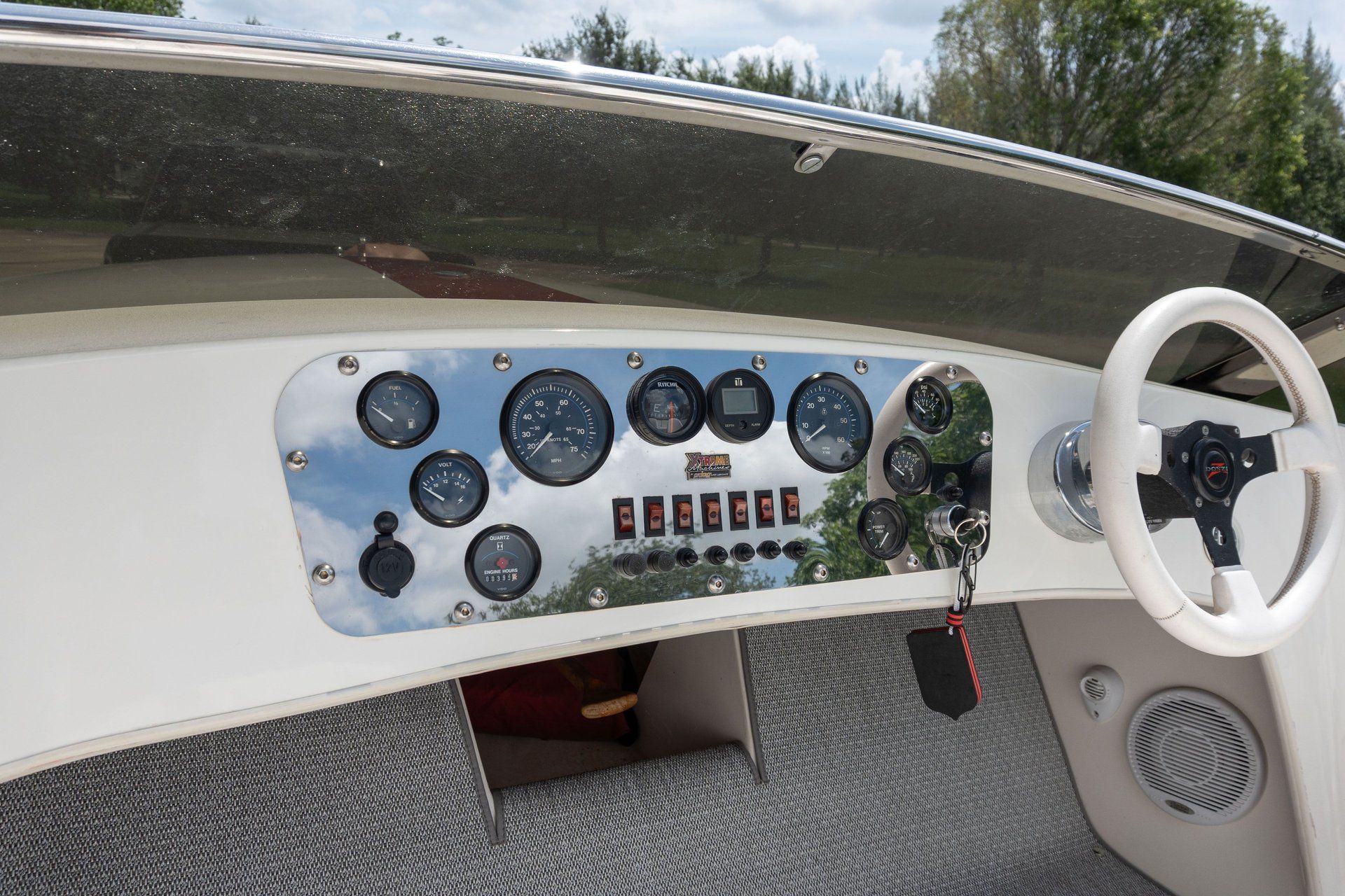 Dashboard of a 1995 Donzi Classic with multiple gauges and a steering wheel.