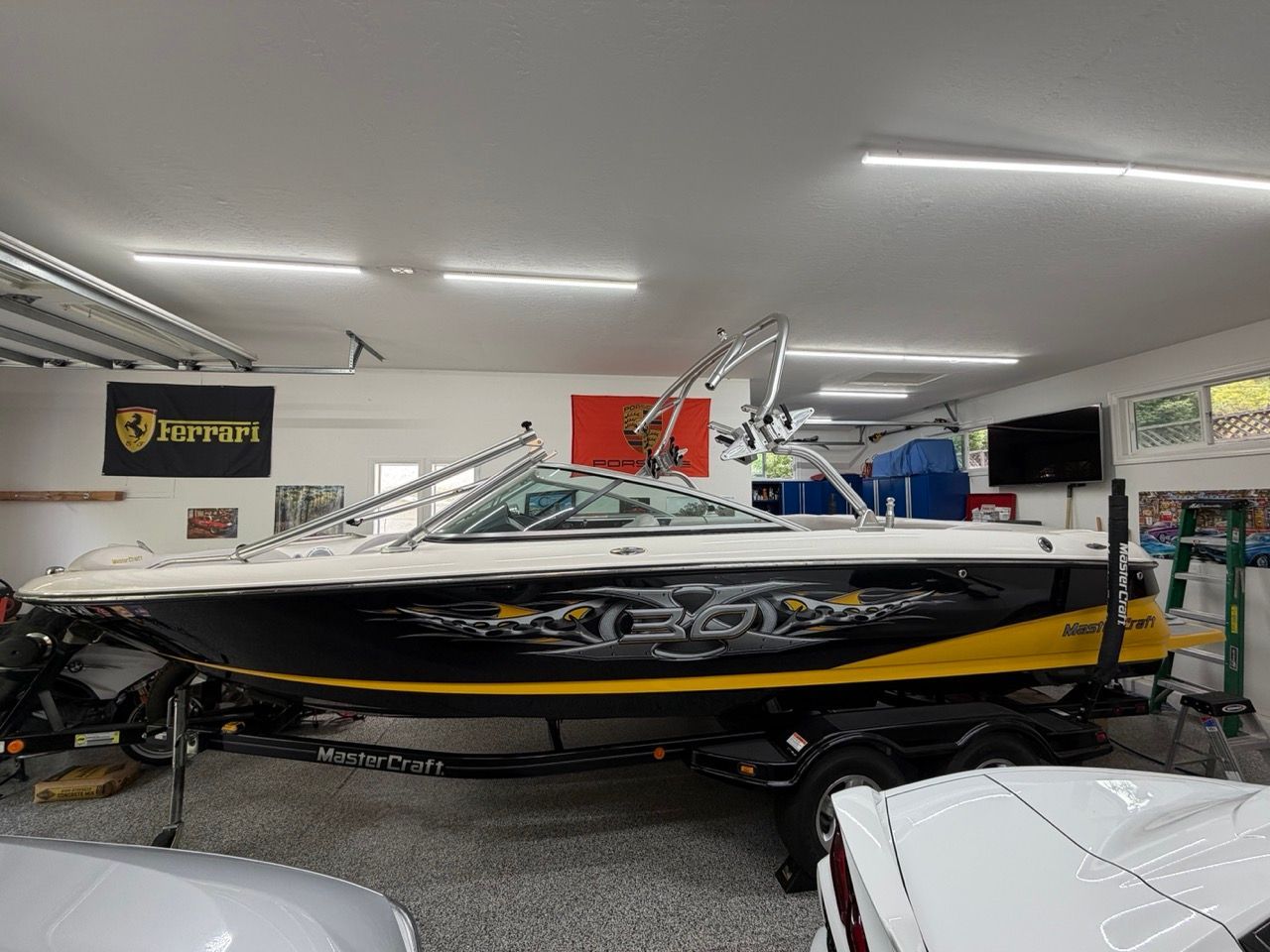 2006 MasterCraft X30 in a garage with Ferrari poster.