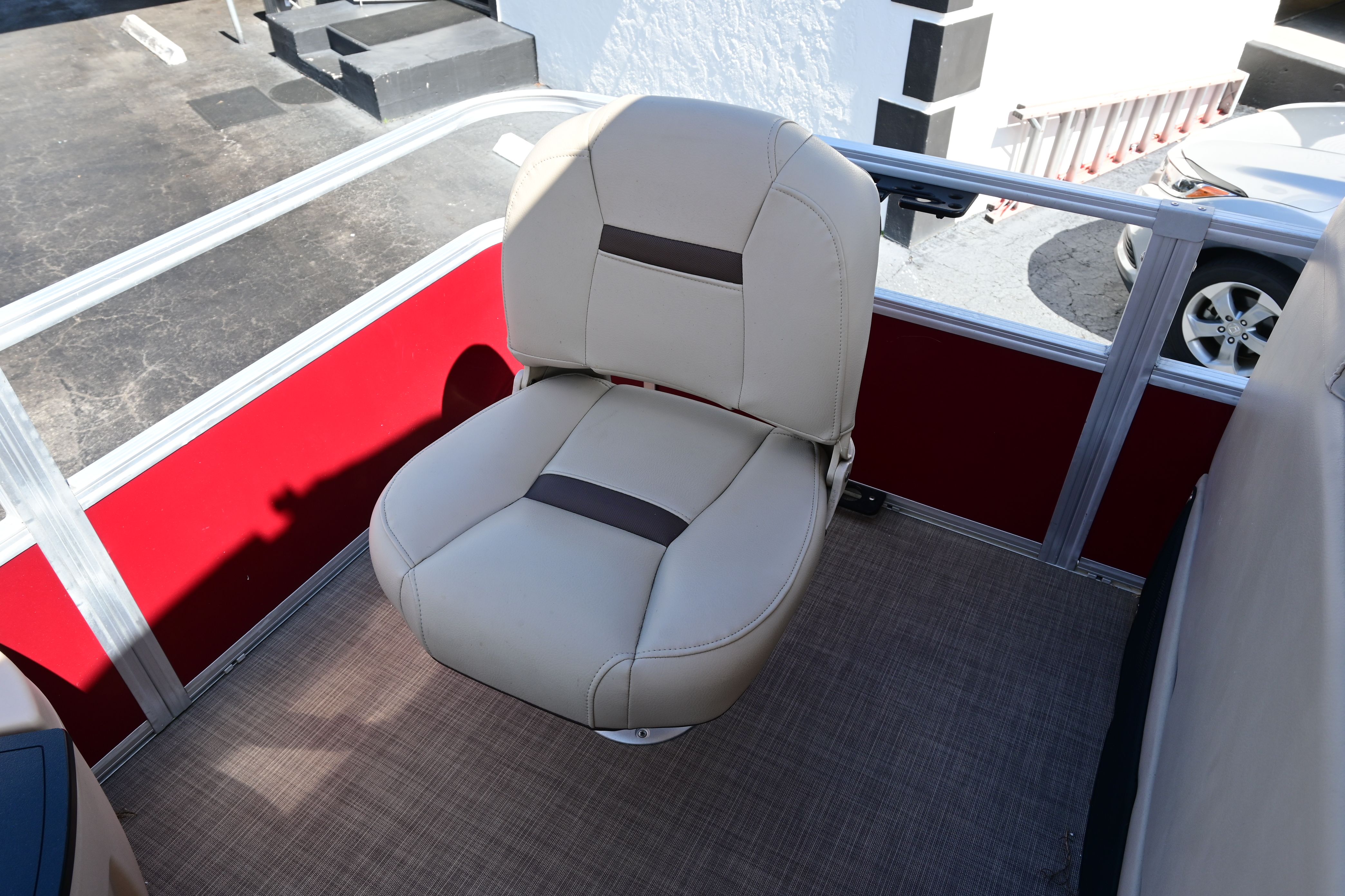 Seat on a 2019 Sun Tracker FISHI boat, beige upholstery.