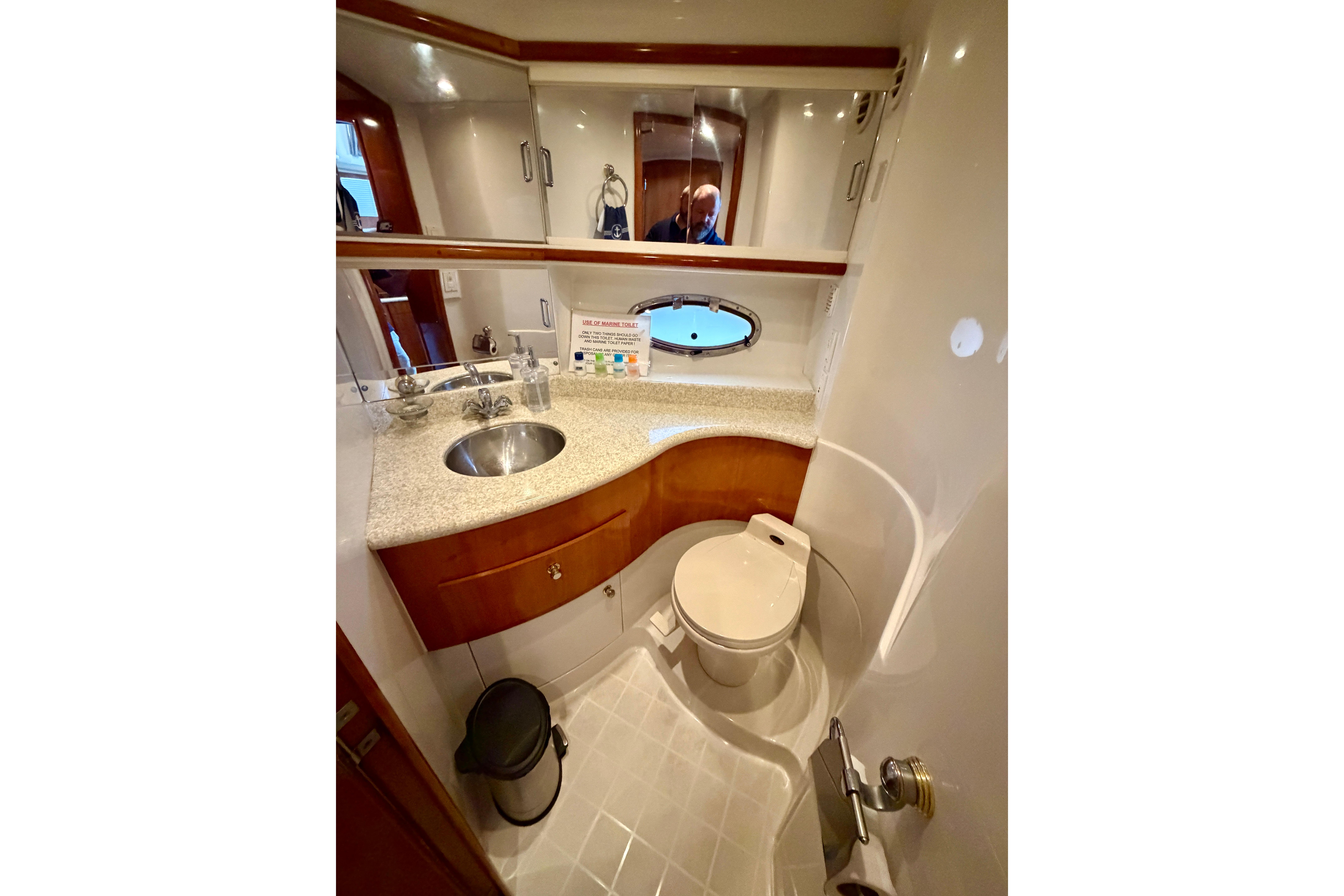 Luxurious bathroom in 2000 Carver 396 Motor Yacht with modern fixtures and elegant design.