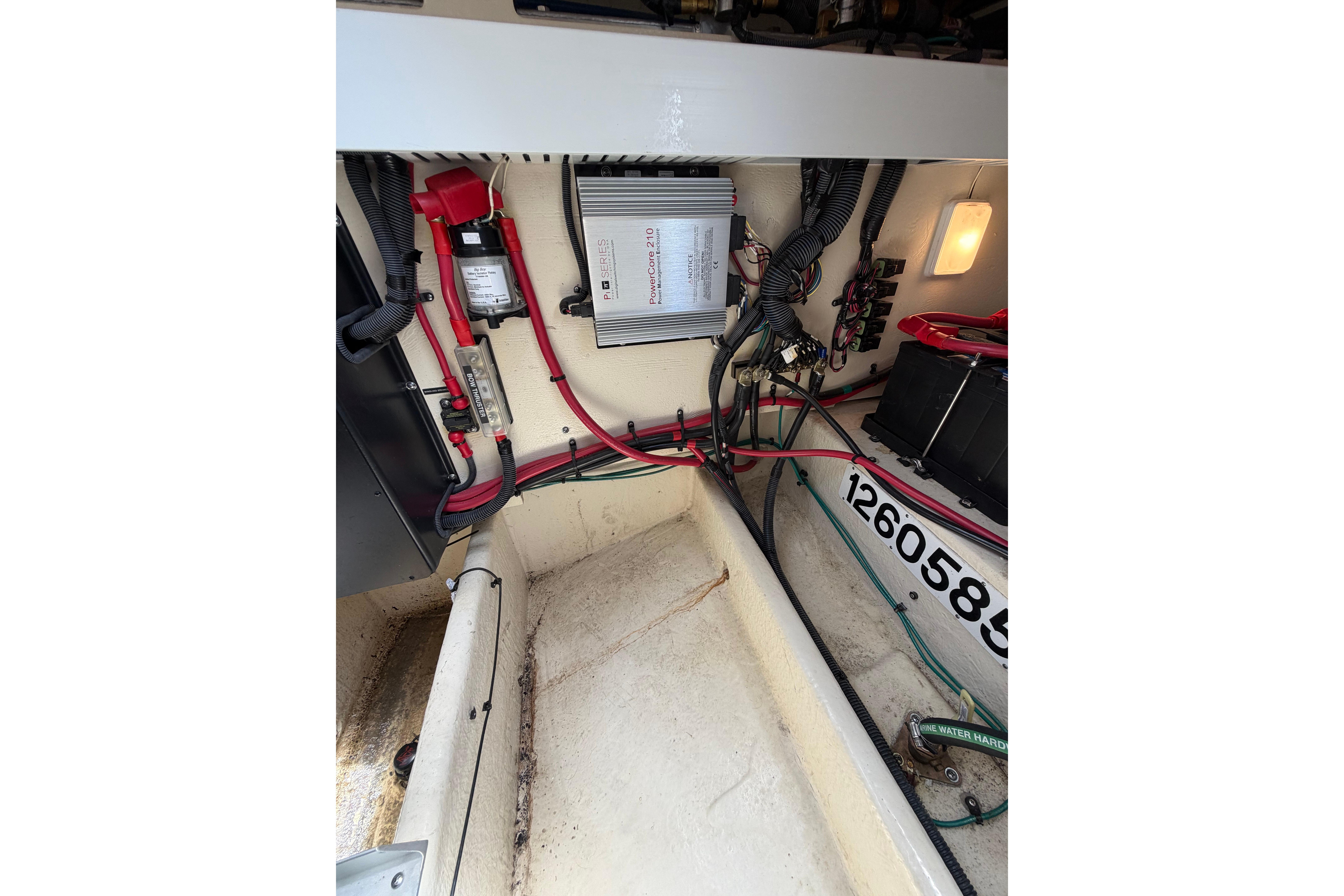 Engine compartment of 2012 Sea Ray Sundancer 370 with wiring and battery components.
