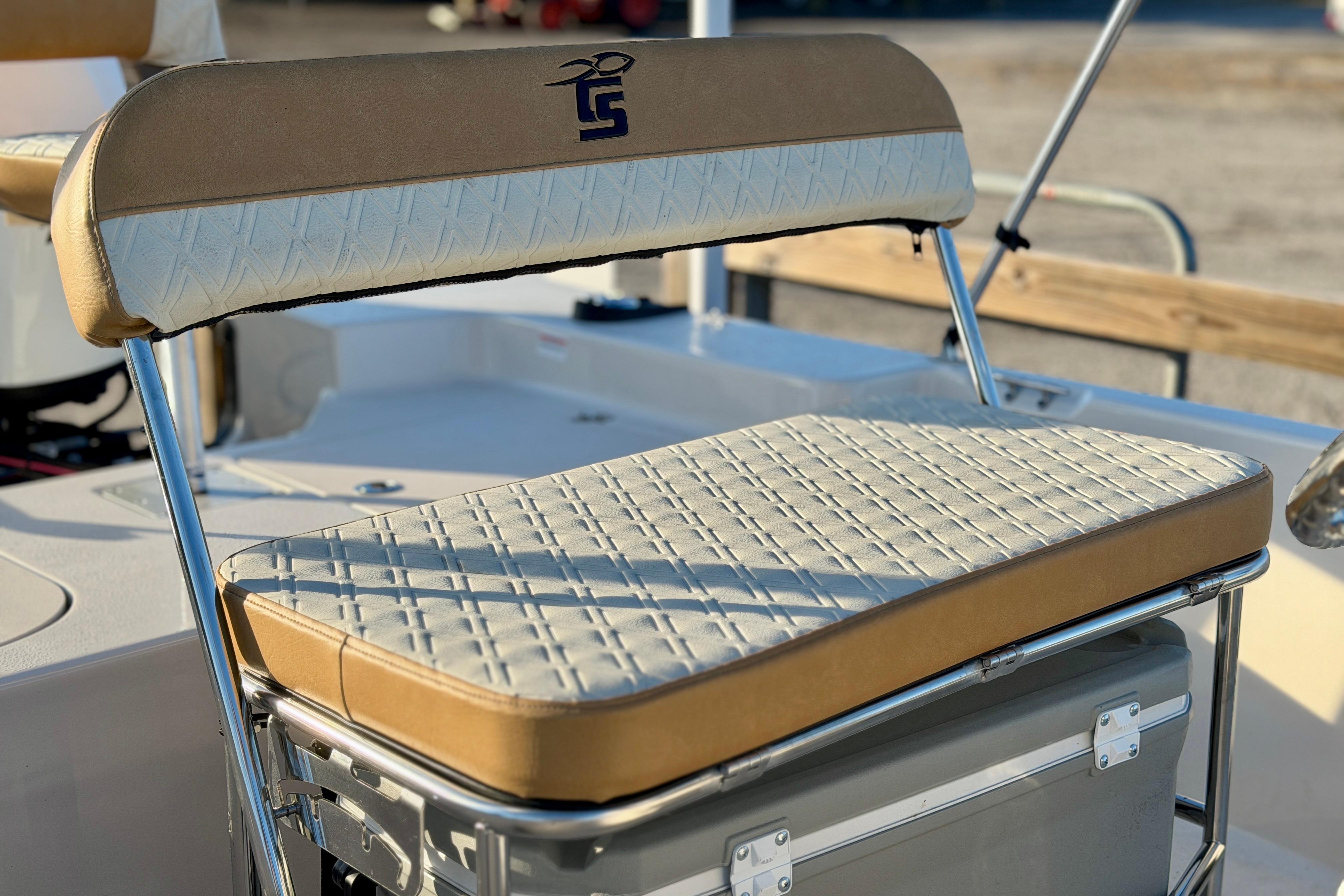 2026 Carolina Skiff 178 JLS boat seat with beige and white upholstery.