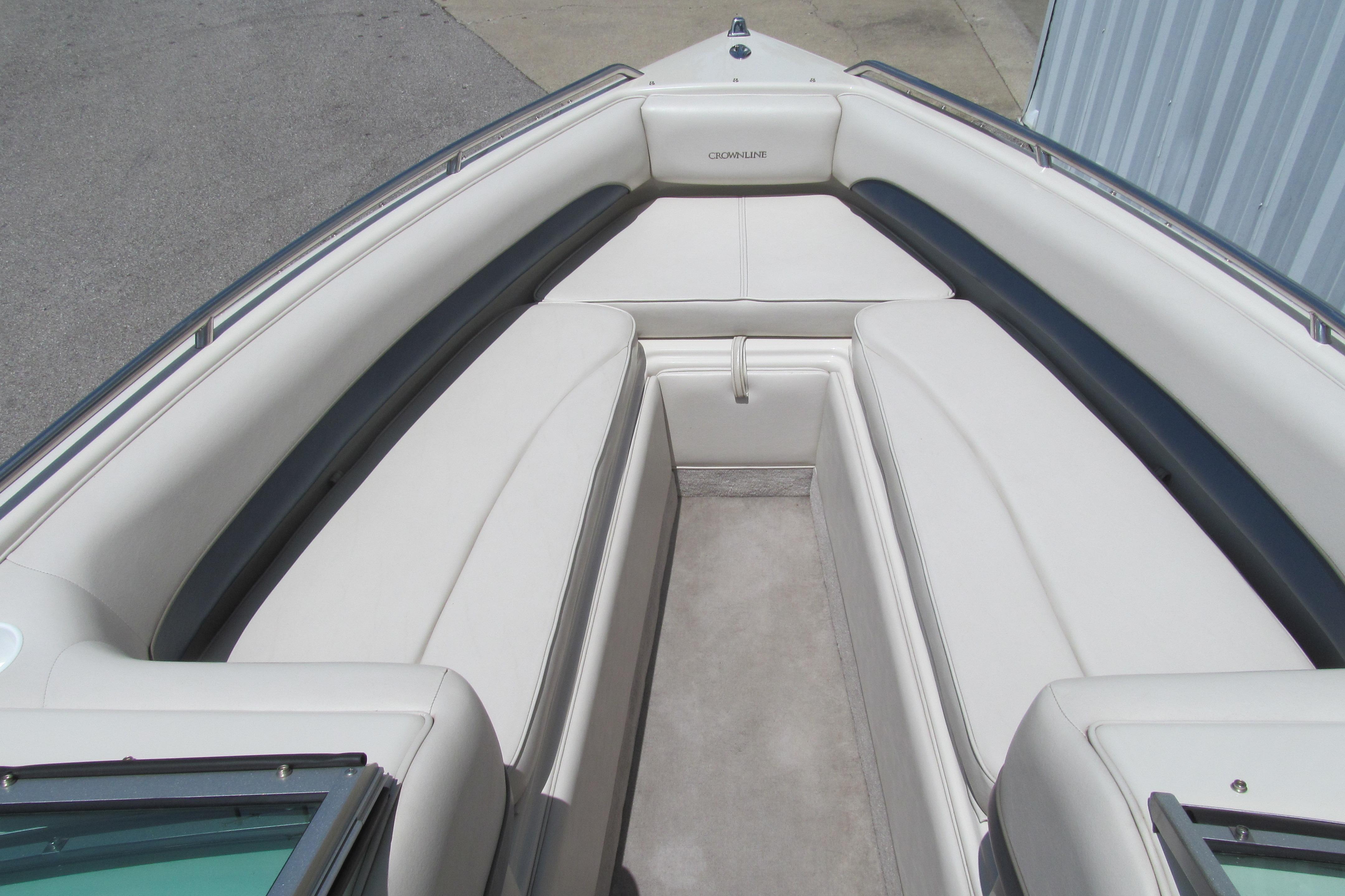 2001 Crownline 225 BR boat interior with white seating and spacious layout.
