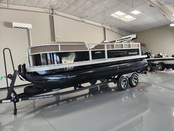 2025 Ranger 200C pontoon boat on trailer in showroom, sleek black design.
