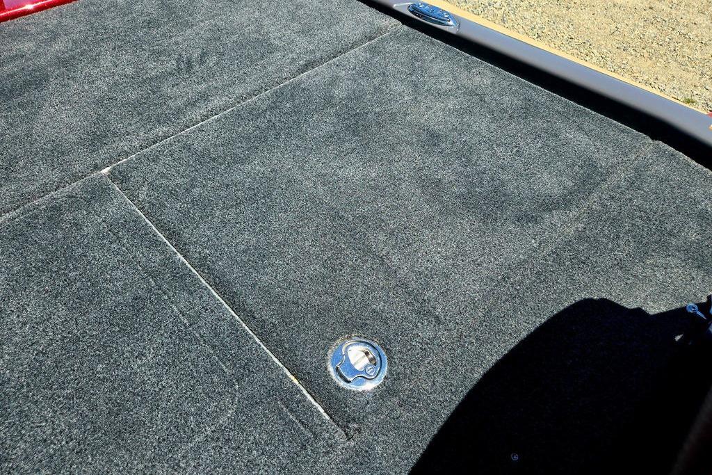 Carpeted deck of 2026 Skeeter ZXE20 boat with storage hatch.
