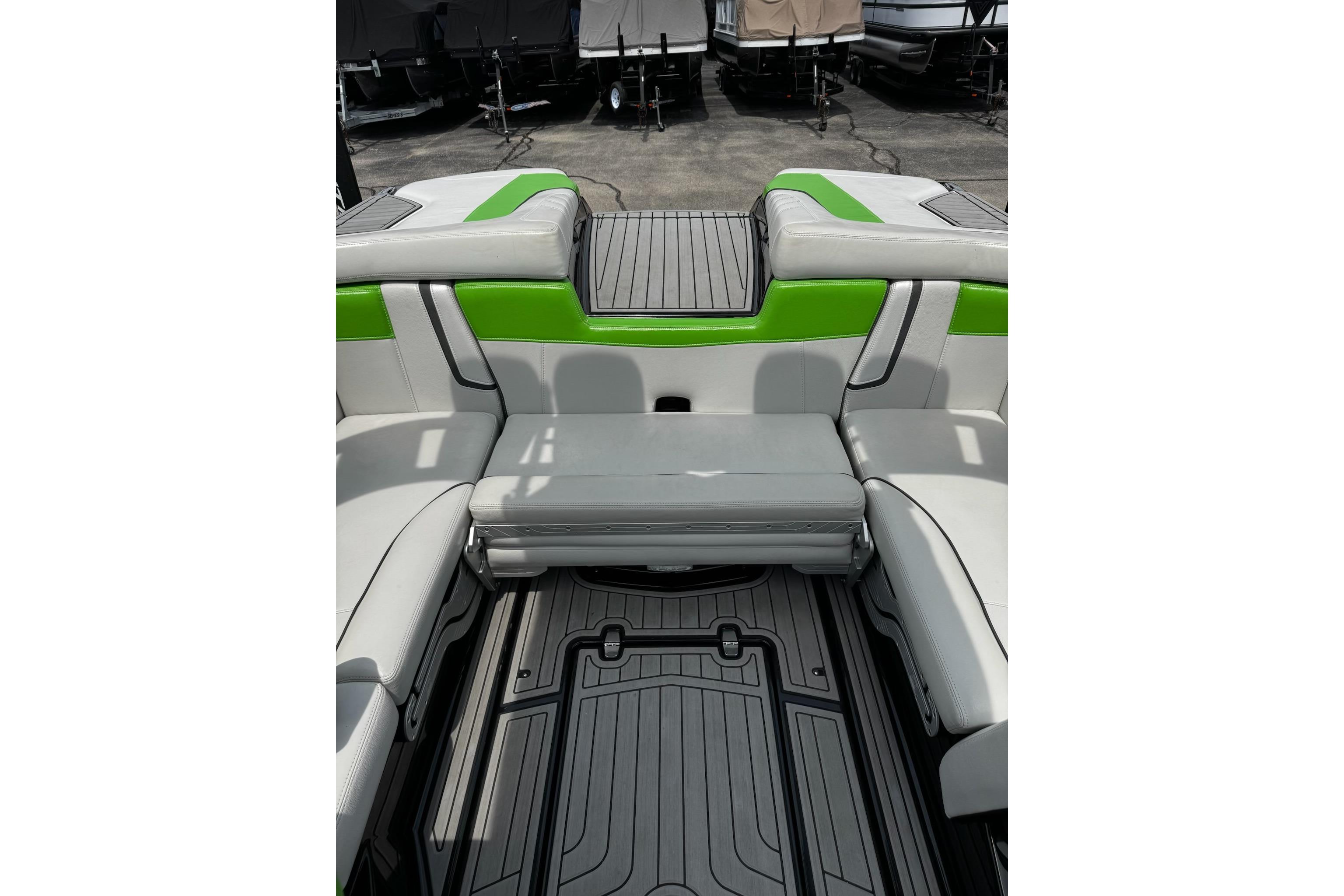 2014 Nautique Super Air Nautique G21 interior with green and gray seating.