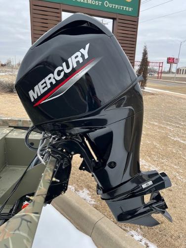2025 Tracker Grizzly 1648 SC with Mercury outboard motor, parked outdoors.