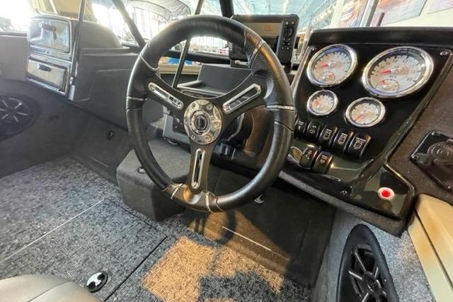 Interior of 2026 Tracker Targa V-18 WT boat with steering wheel and gauges.