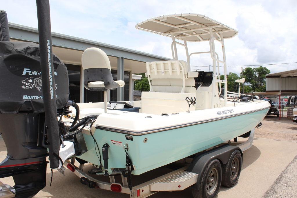 2026 Skeeter SX230 boat on trailer, featuring a sleek design and spacious seating.