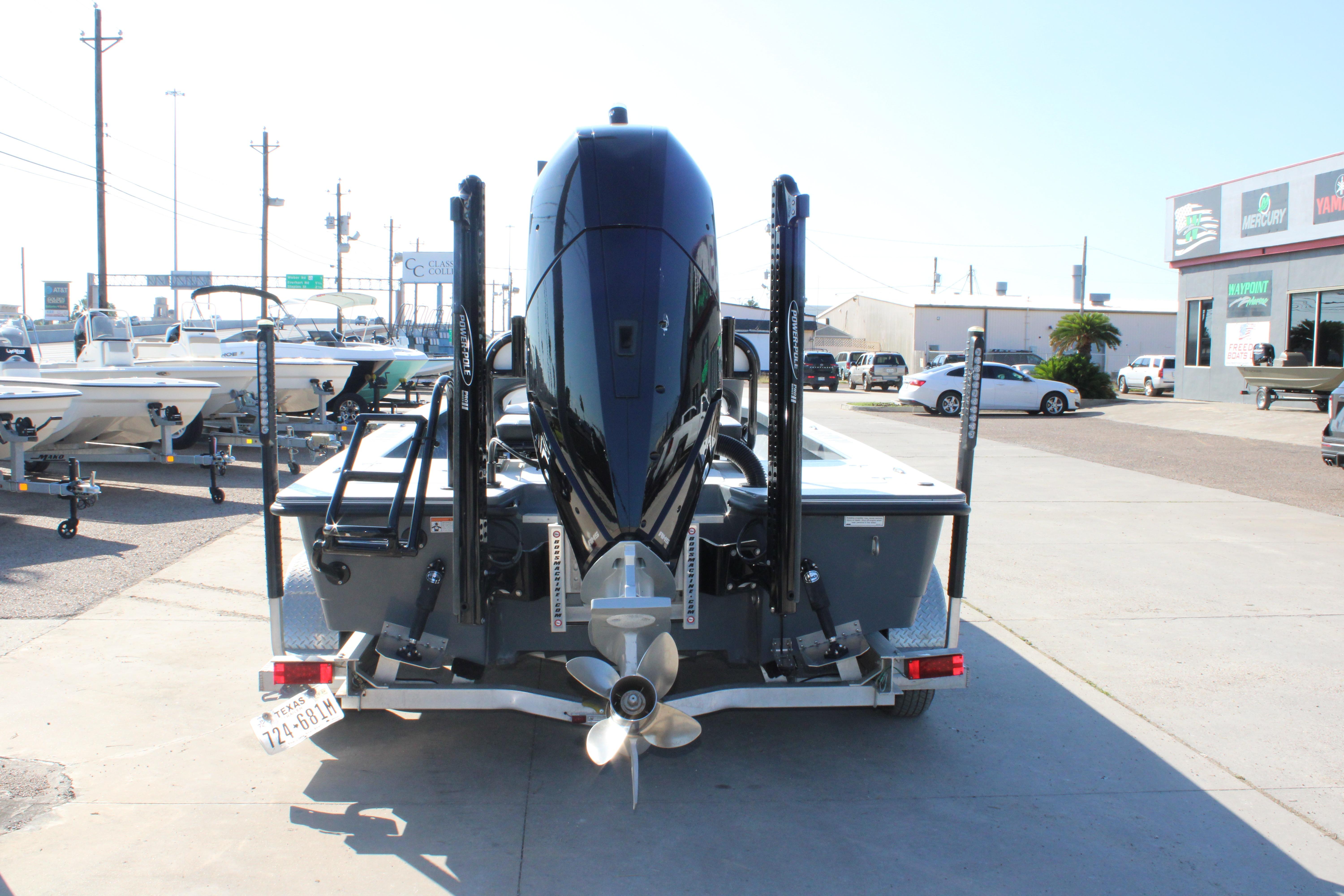 2023 Mamba 24VX boat on trailer, rear view, in a dealership lot.