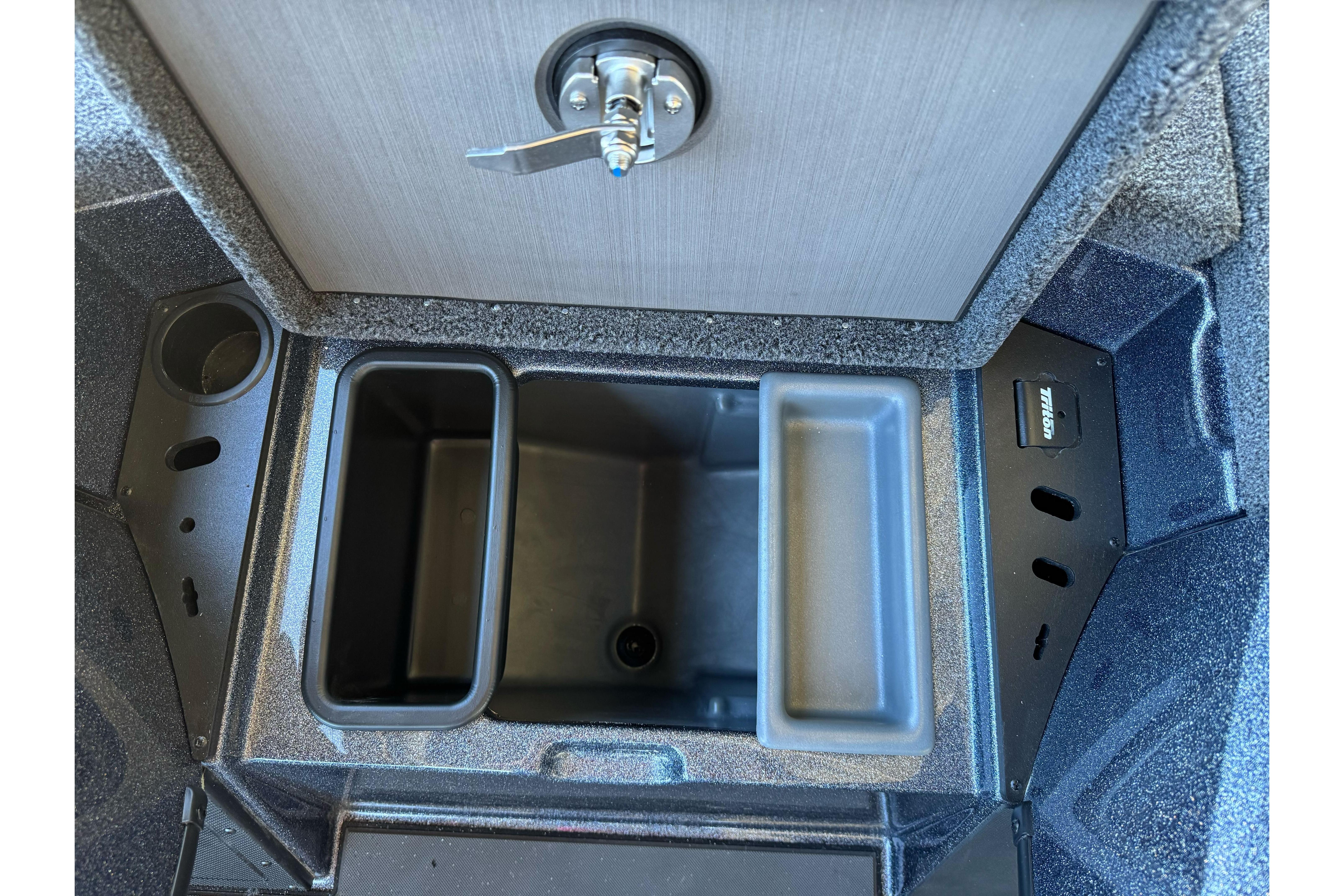 2026 Triton 21XP Patriot boat storage compartment with secure latch and organized interior layout.