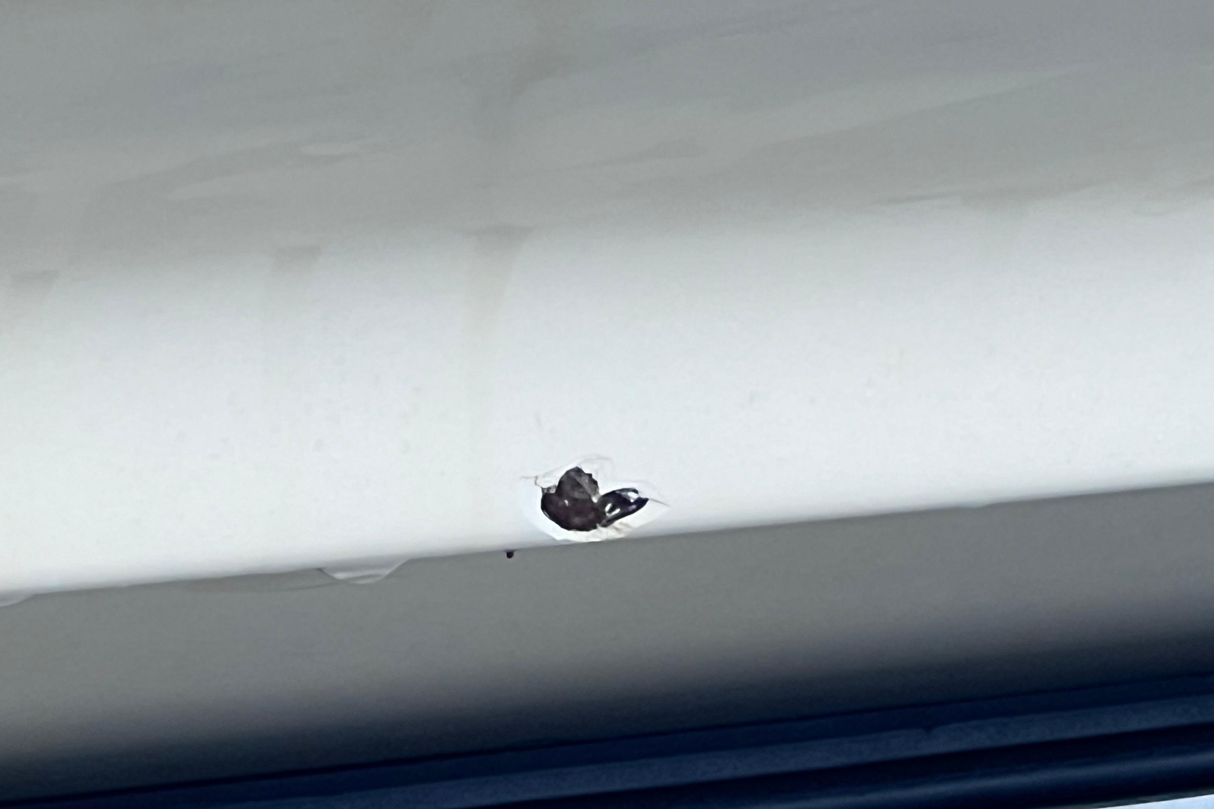 Damaged hull on 2004 Pursuit 2870 Walkaround boat, showing a visible crack.