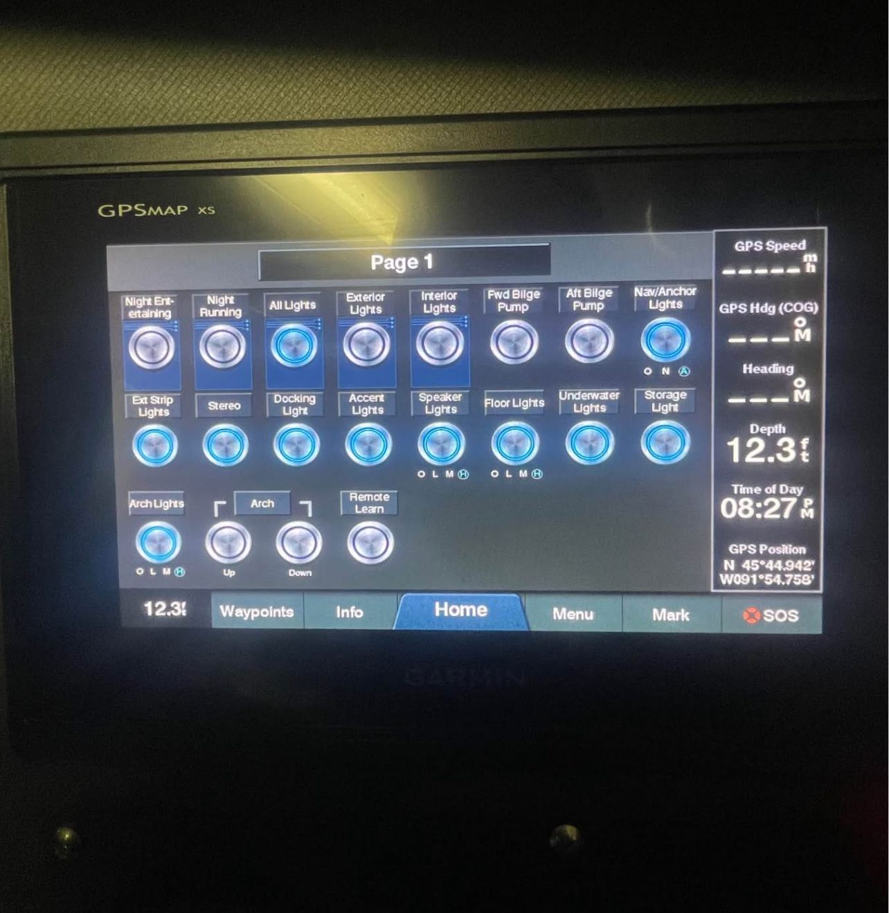 Electronic control display showing various boat functions and GPS data.