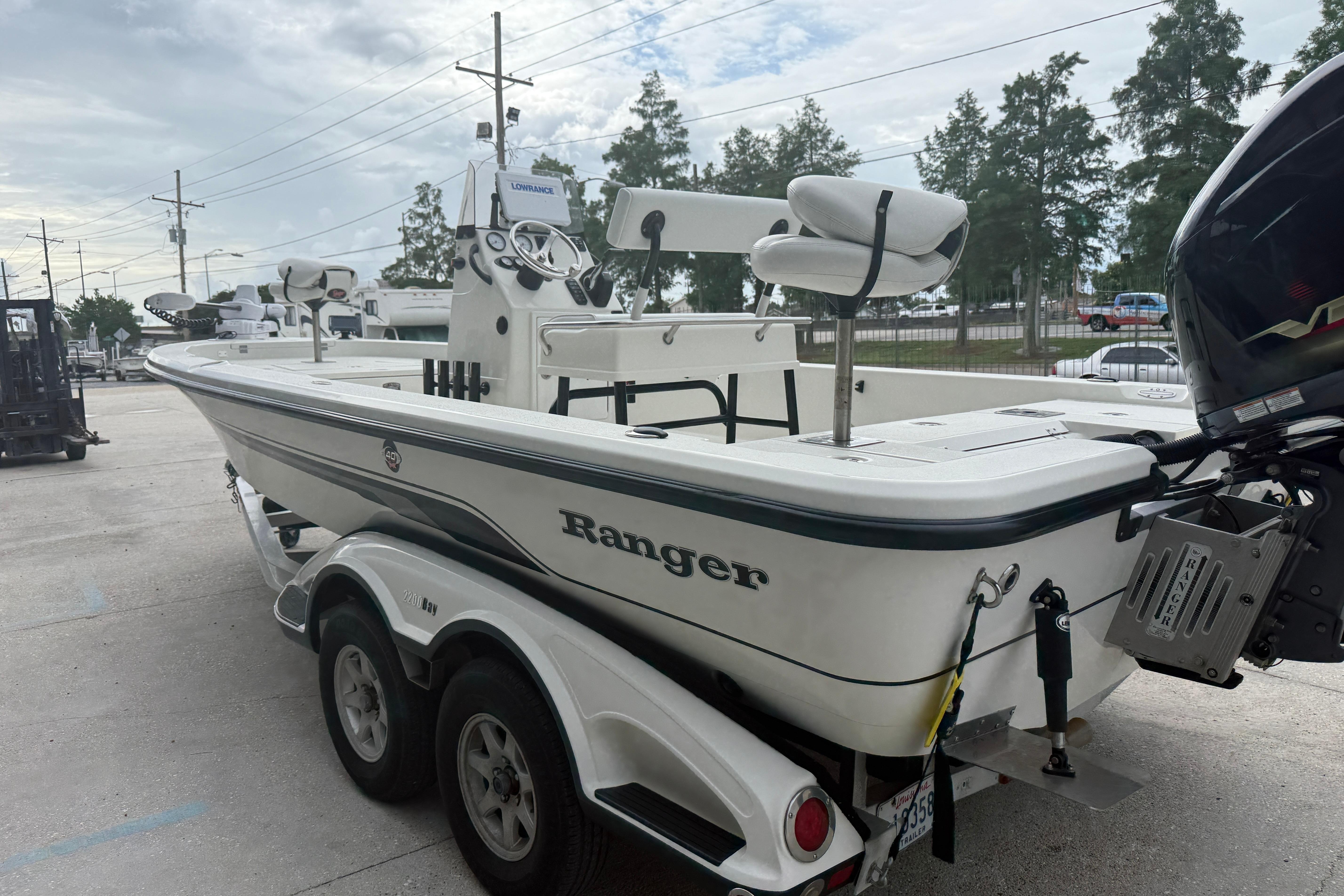 2007 Ranger 2200 Bay Ranger boat on trailer, parked outdoors.