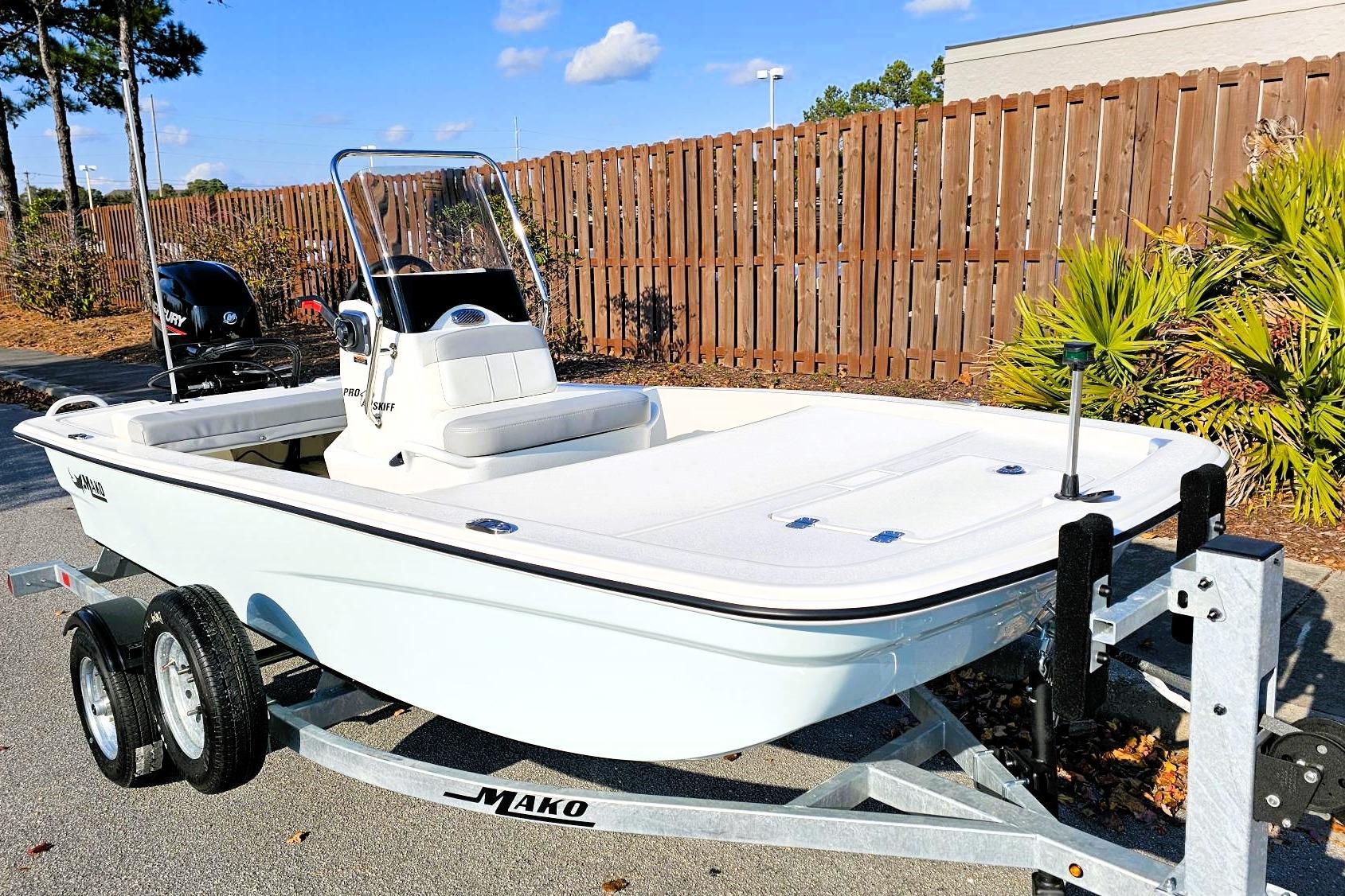 2026 Mako Pro Skiff 13 CC boat on trailer, parked outdoors.