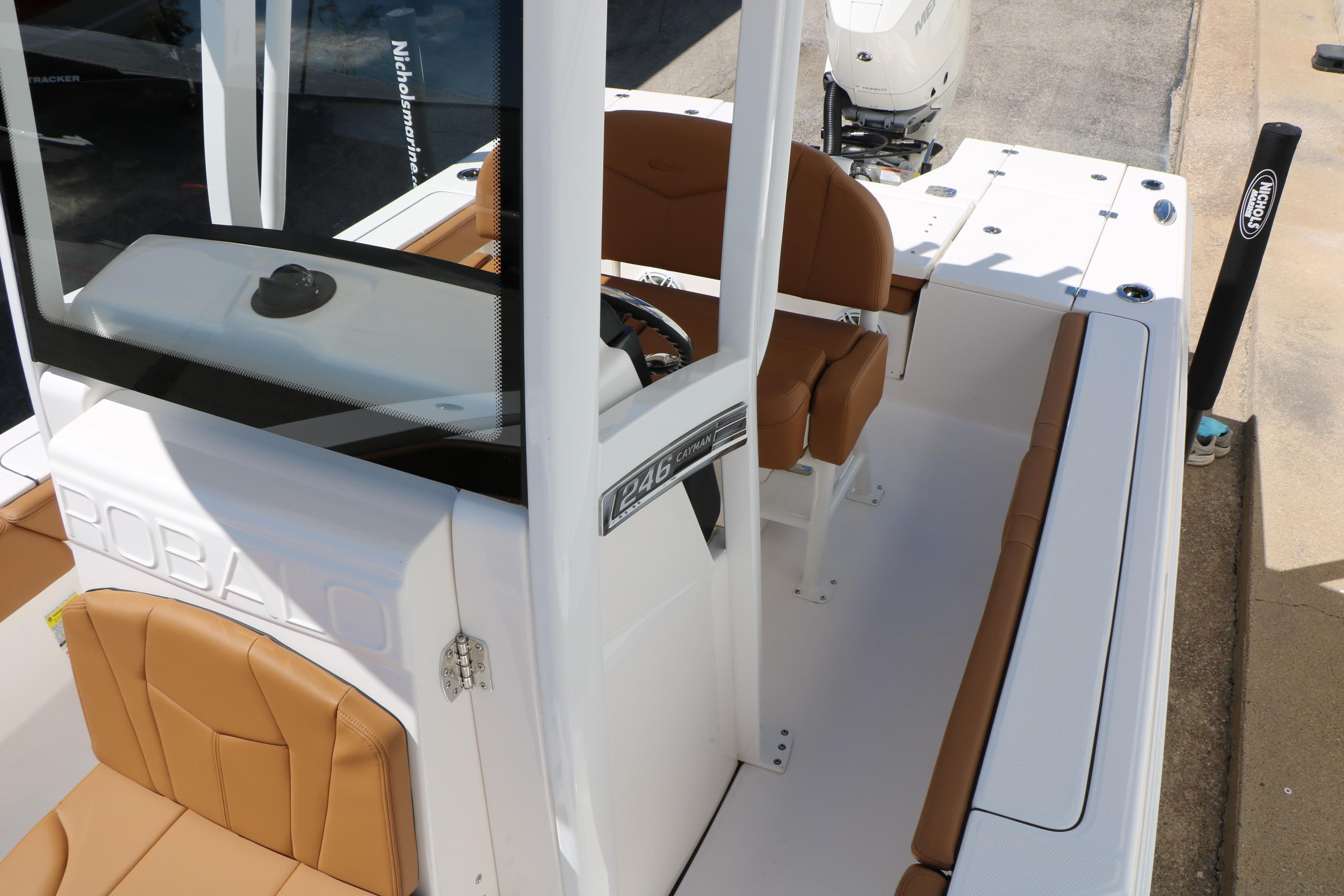 2026 Robalo 246 Cayman boat interior with tan seating and console.