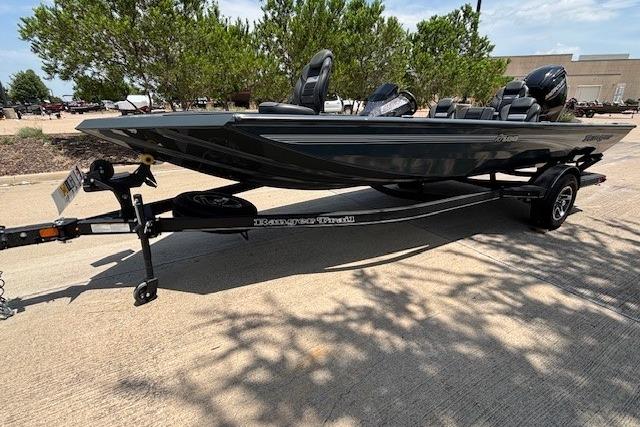 2026 Ranger RT188 boat on trailer, parked outdoors, with trees in the background.