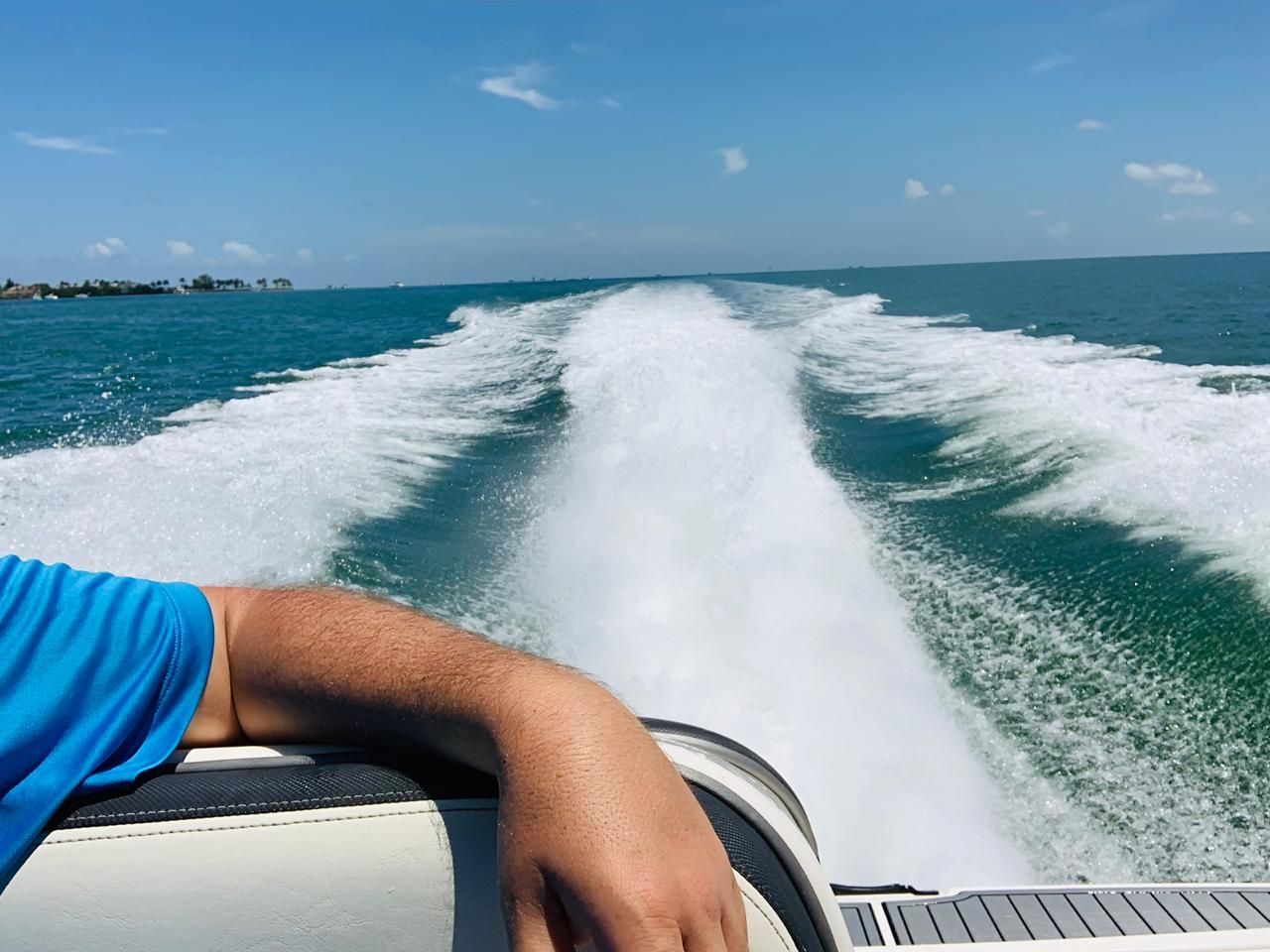 Yamaha AR240 boat 2016 on open sea, arm resting on seat.