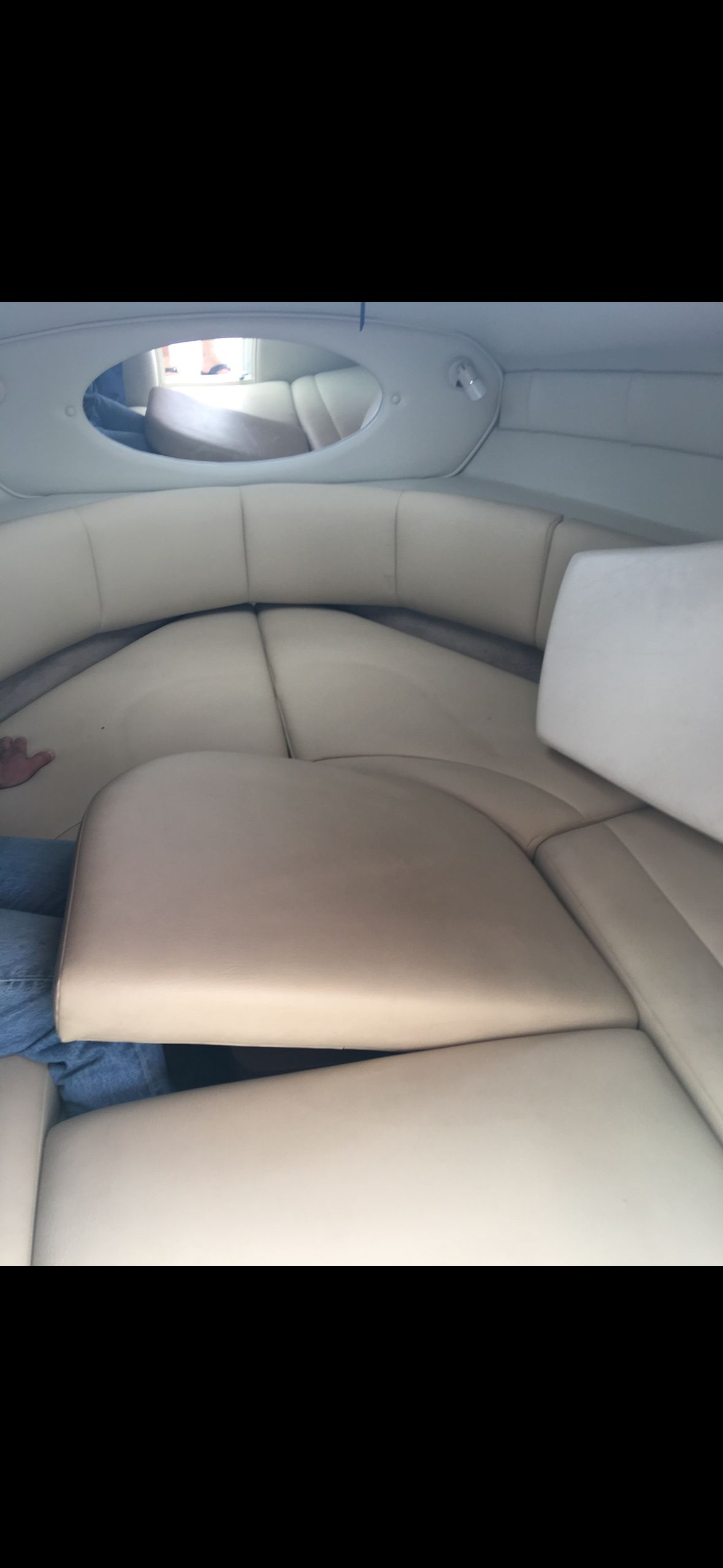 Interior of a 2006 Chaparral 235 SSi with beige upholstery.