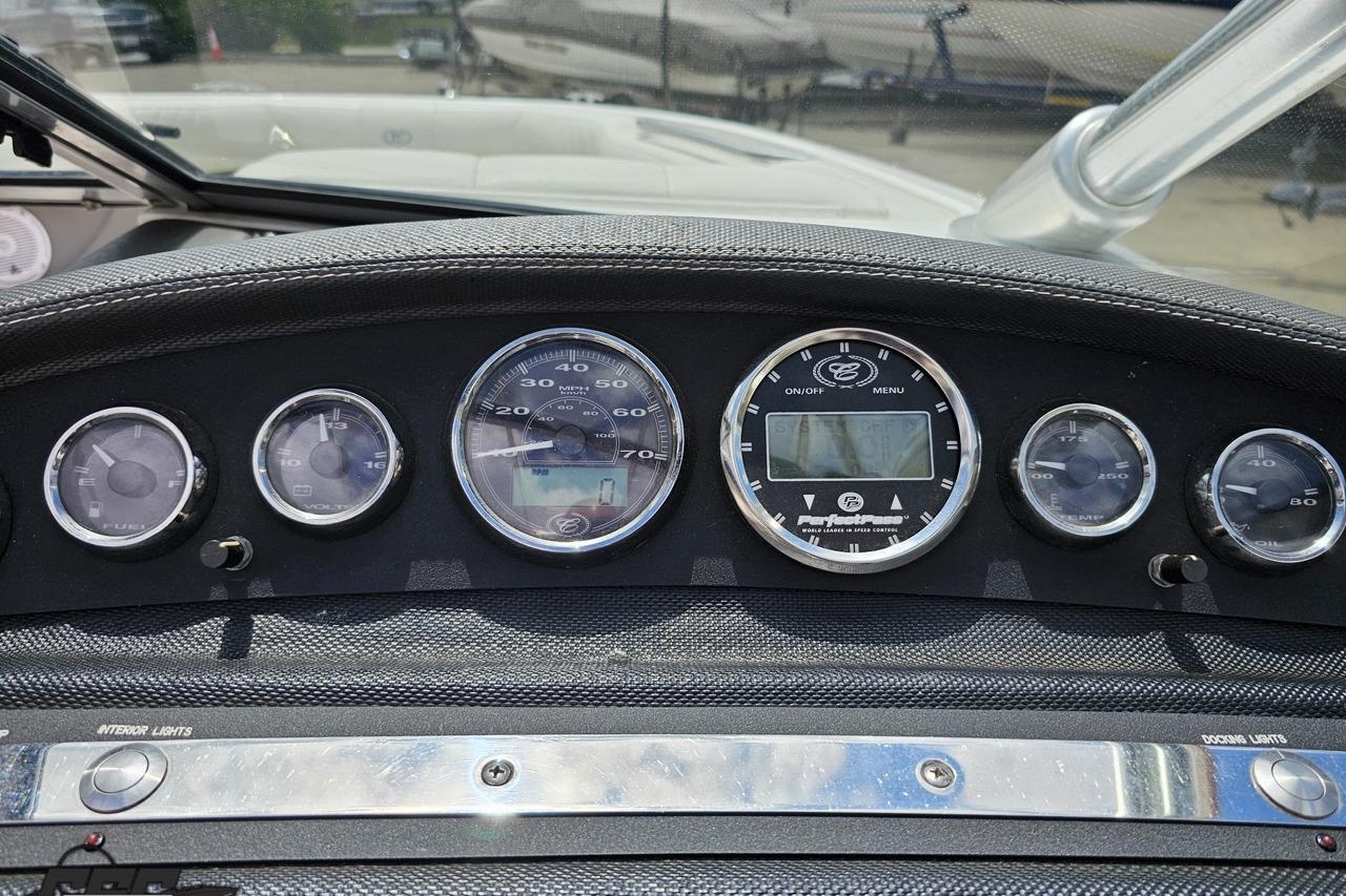 Dashboard of a 2010 Cobalt 232 WSS boat with various gauges and controls.