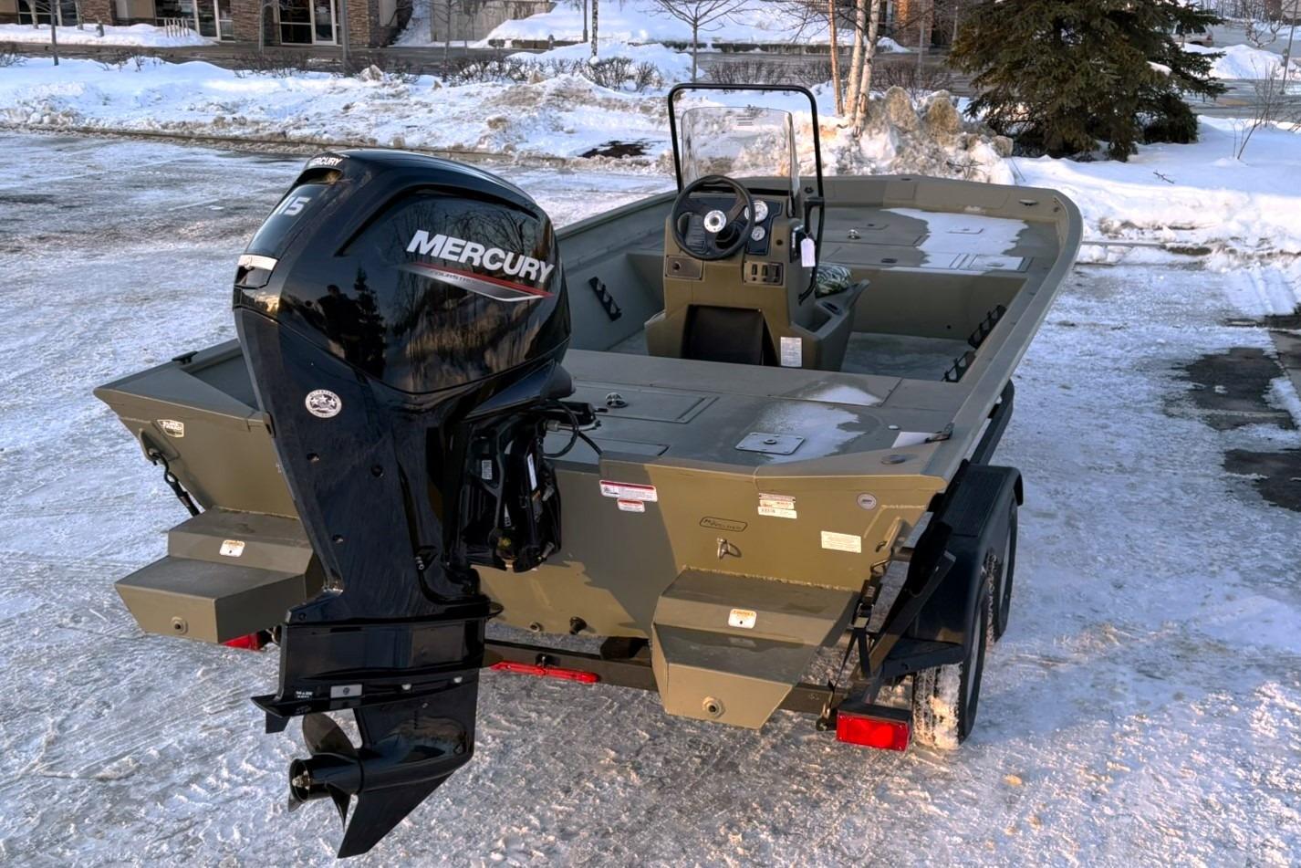 2024 Tracker Grizzly 2072 CC boat with Mercury engine in snow.