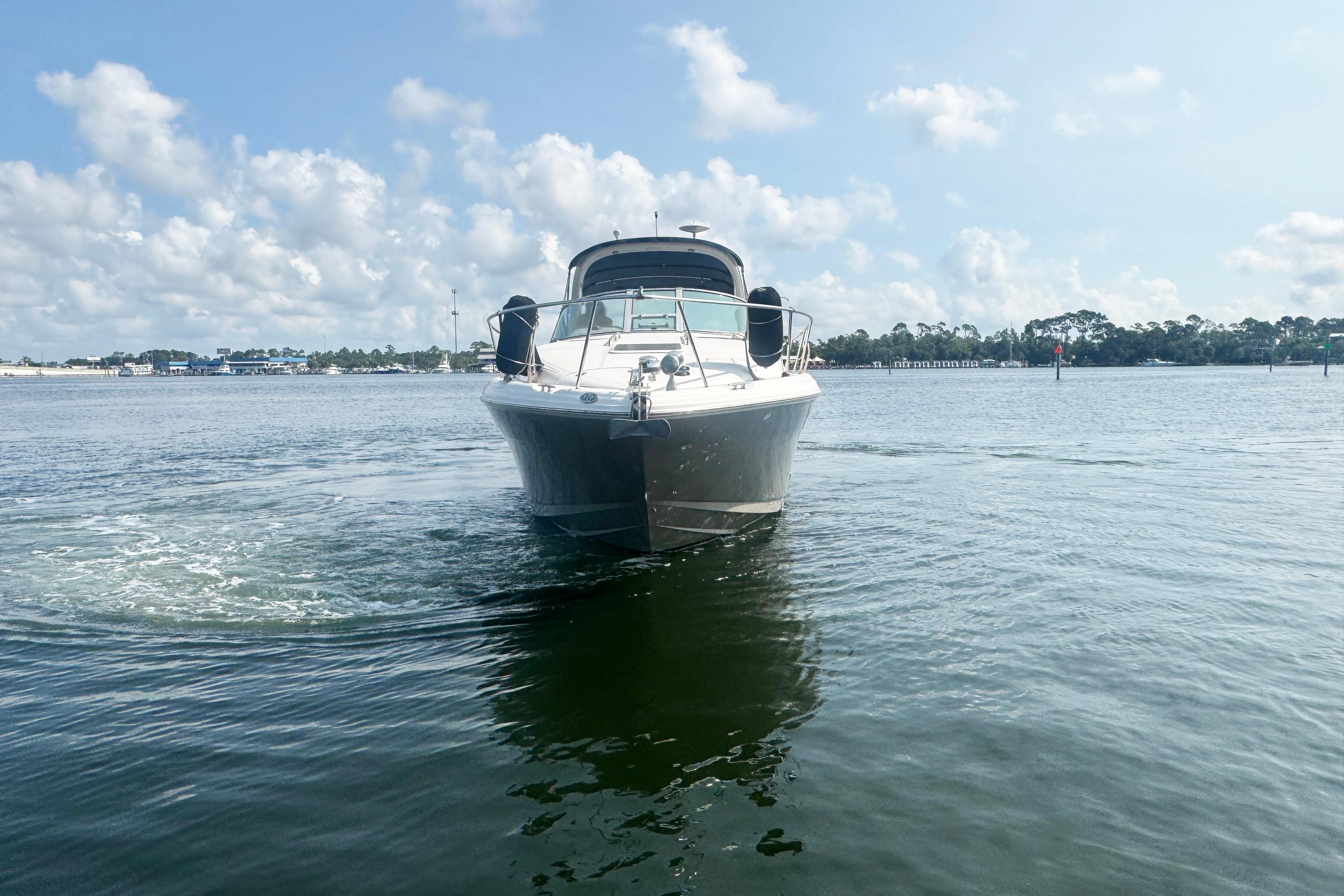 2006 Sea Ray 300 Sundancer cruising on a calm, sunny day.