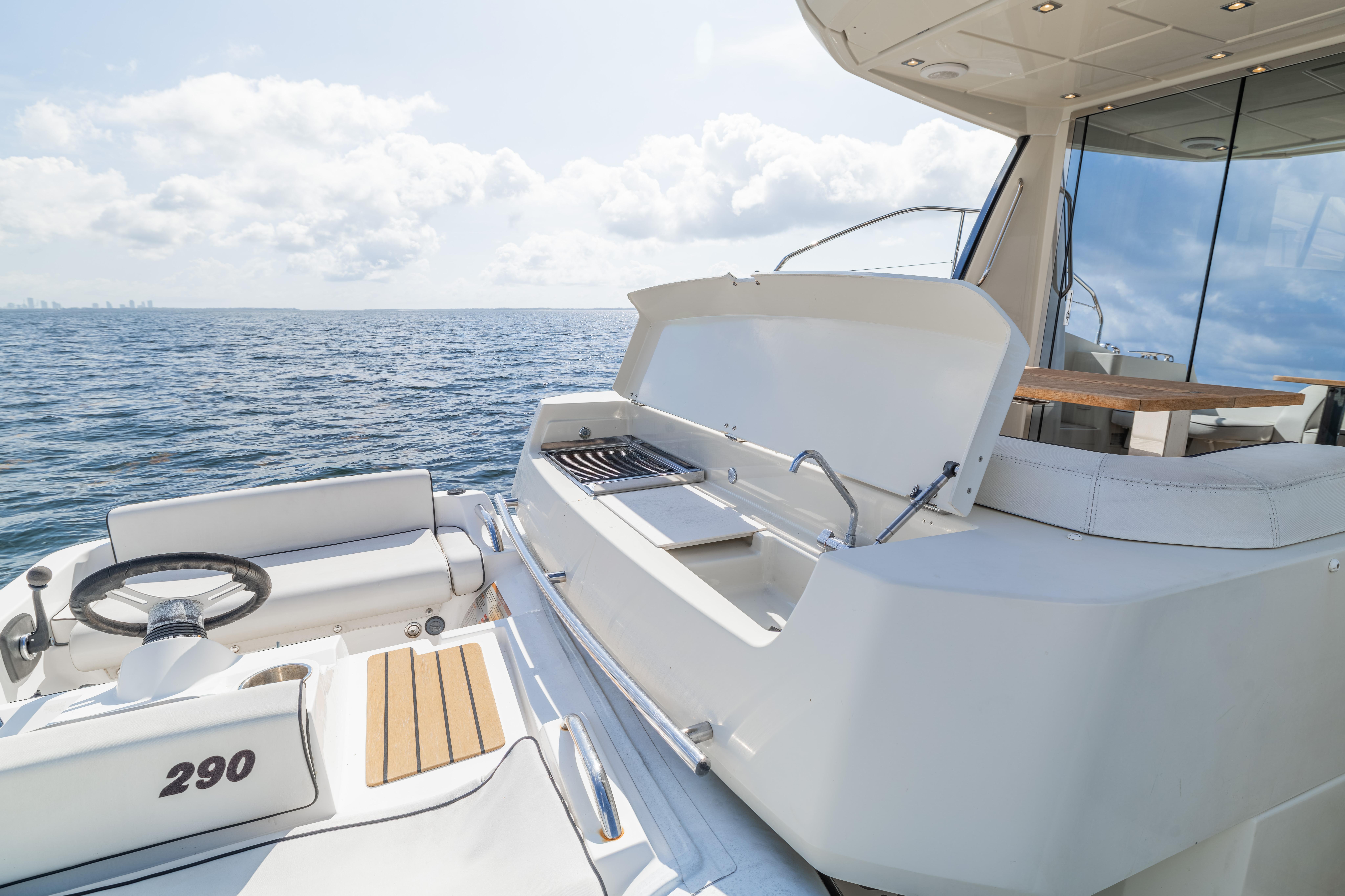 2017 Monte Carlo Yachts MC5 deck with seating and ocean view.