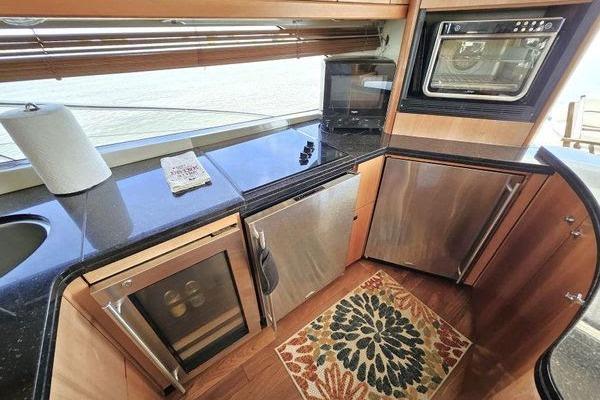 Luxurious kitchen interior of 2005 Sunseeker Manhattan 66 yacht with modern appliances.