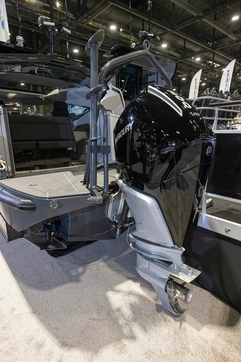 2024 G-Force 8 boat with powerful outboard motor displayed at a boat show.